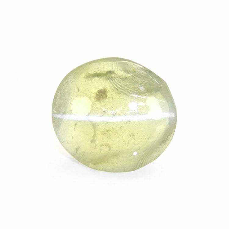 Close-up of a Chrysoberyl cat’s eyes gemstone showcasing its distinctive chatoyancy and vibrant yellow-green color.