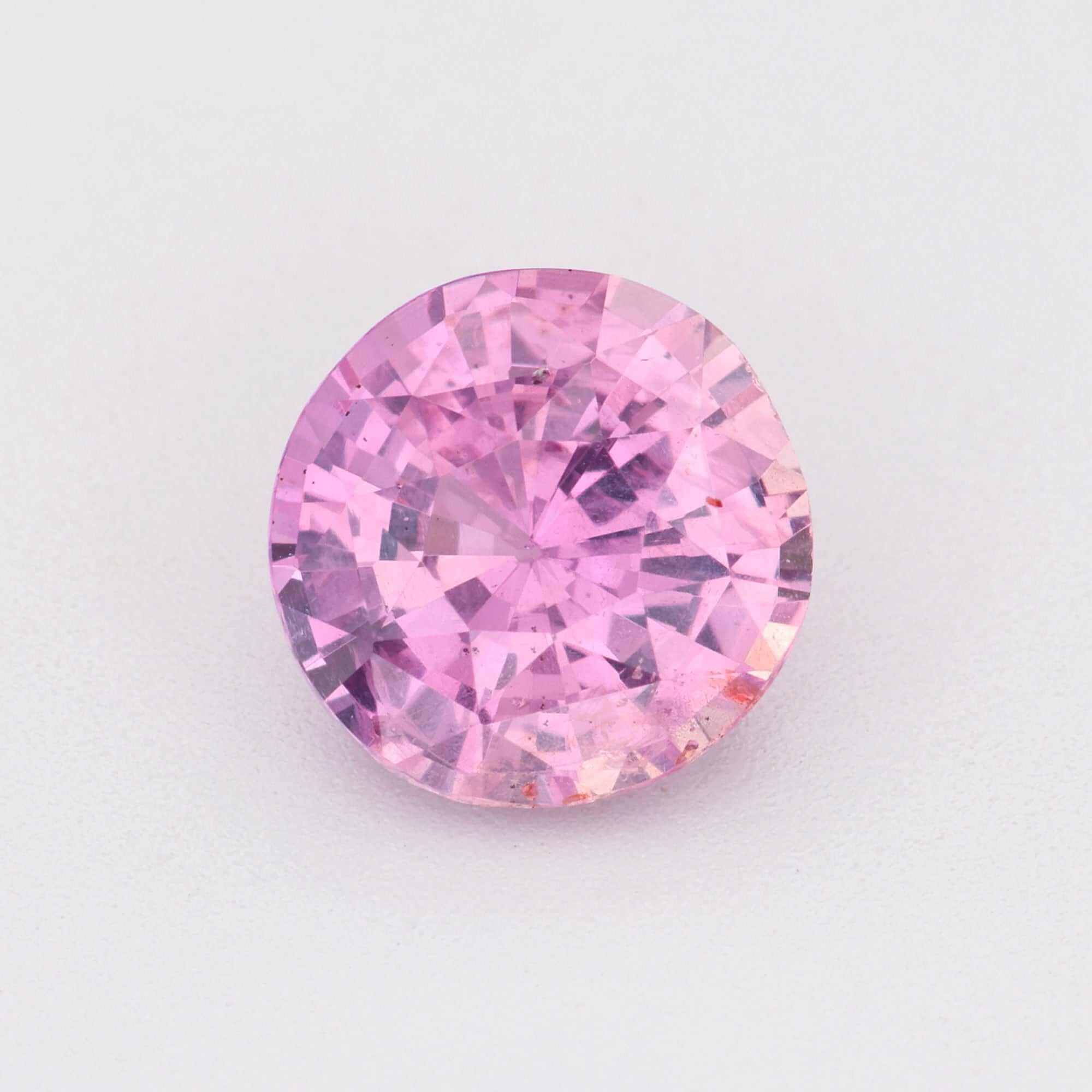 Close-up of a vibrant Pink Sapphire gemstones showcasing its brilliance and color variations