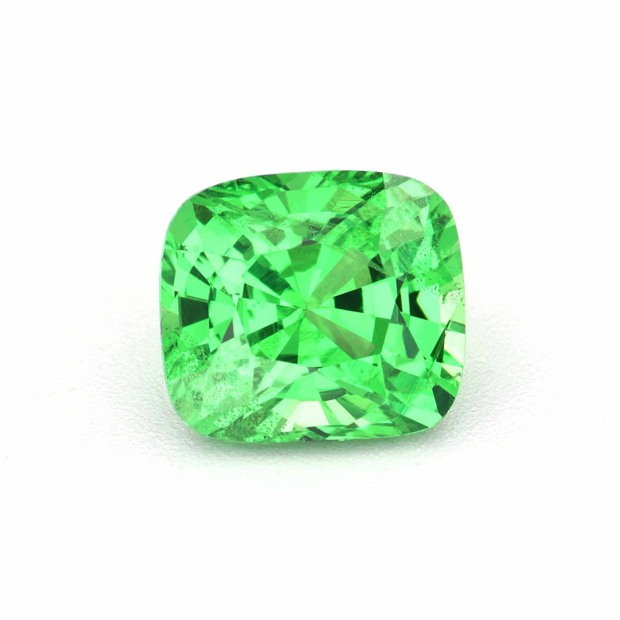 Close-up of a brilliant green Tsavorite garnet gemstones showcasing its vibrant color and rare beauty