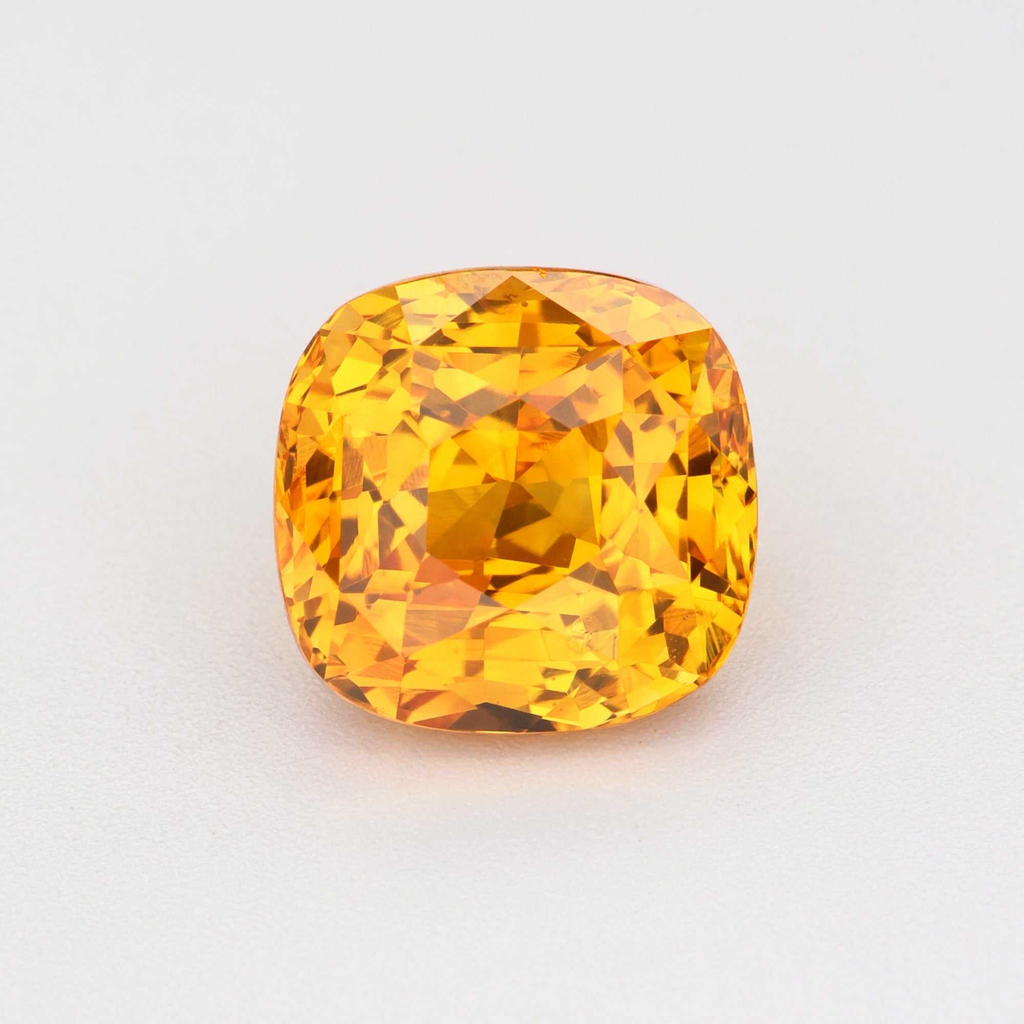 2.19 ct natural orange sapphire gemstone with radiant clarity and warm golden-orange hue