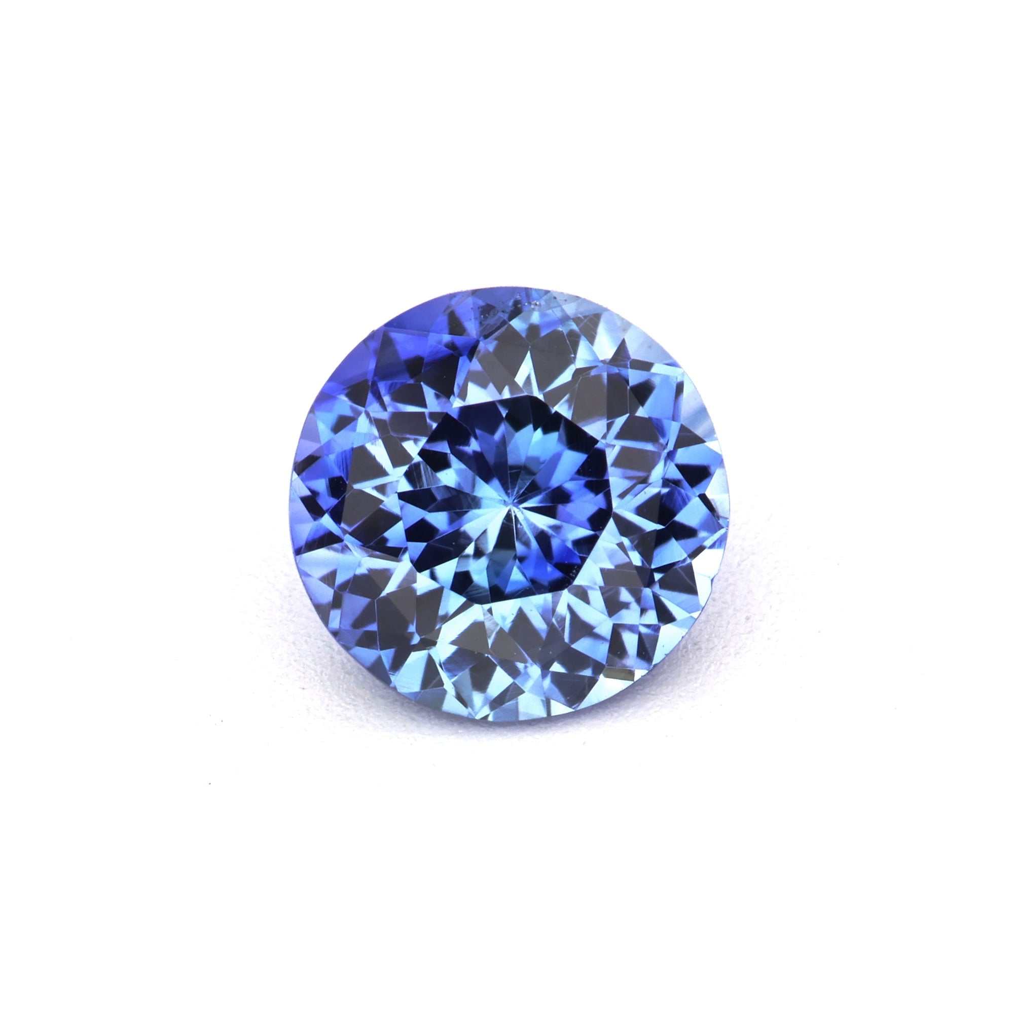 0.87 carat round natural Ceylon blue sapphire gemstone with brilliant cut and deep blue color