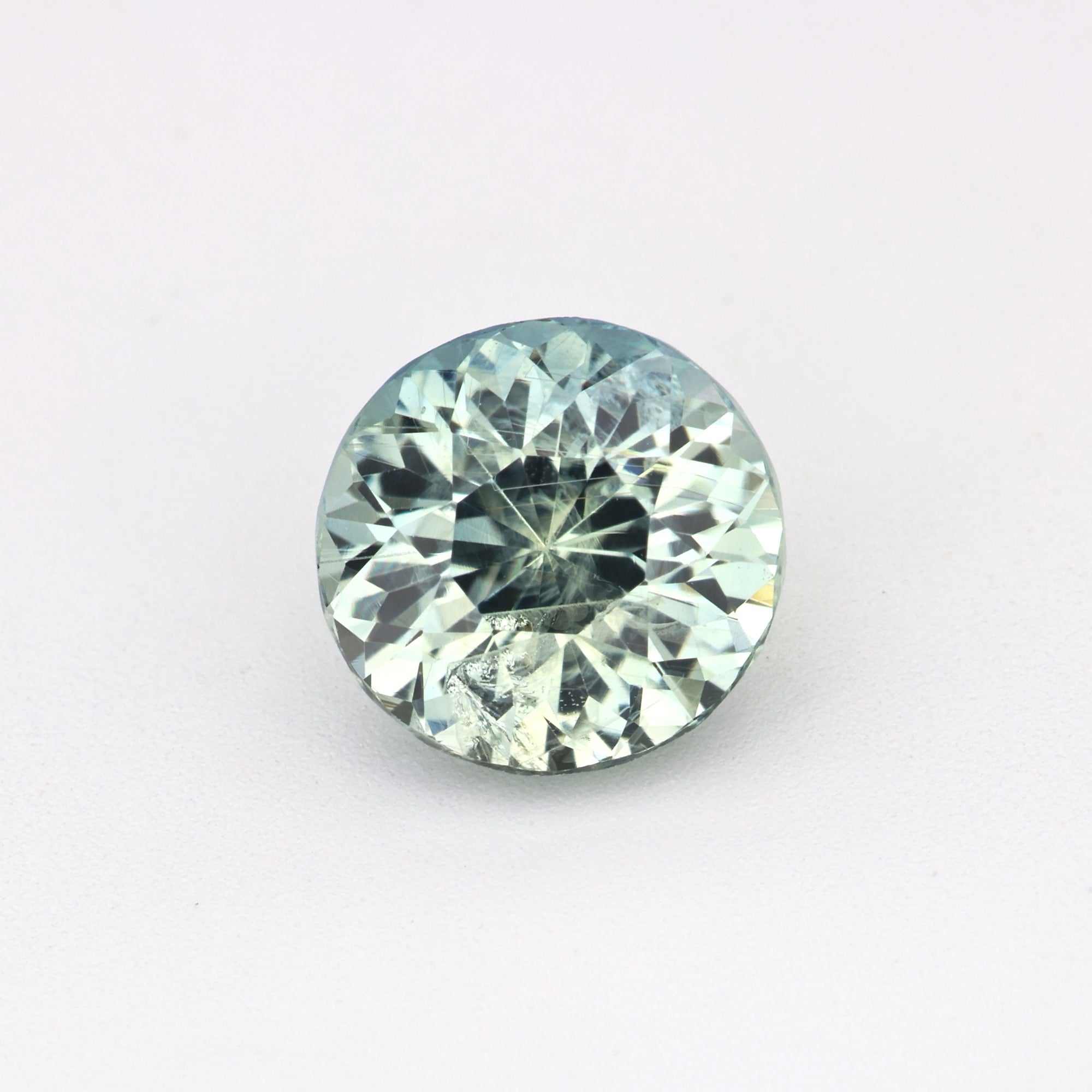 1.70 carat natural unheated green sapphire gemstone with brilliant cut and vivid green hue