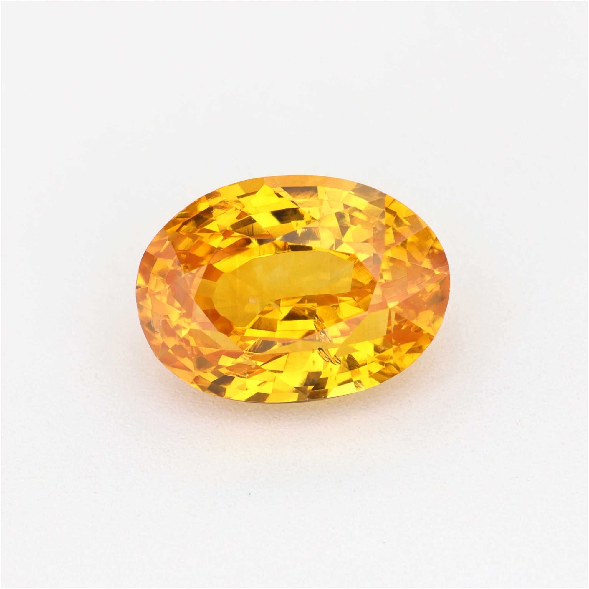 1.34 Ct orange sapphire gemstone with vibrant golden-orange color and clarity