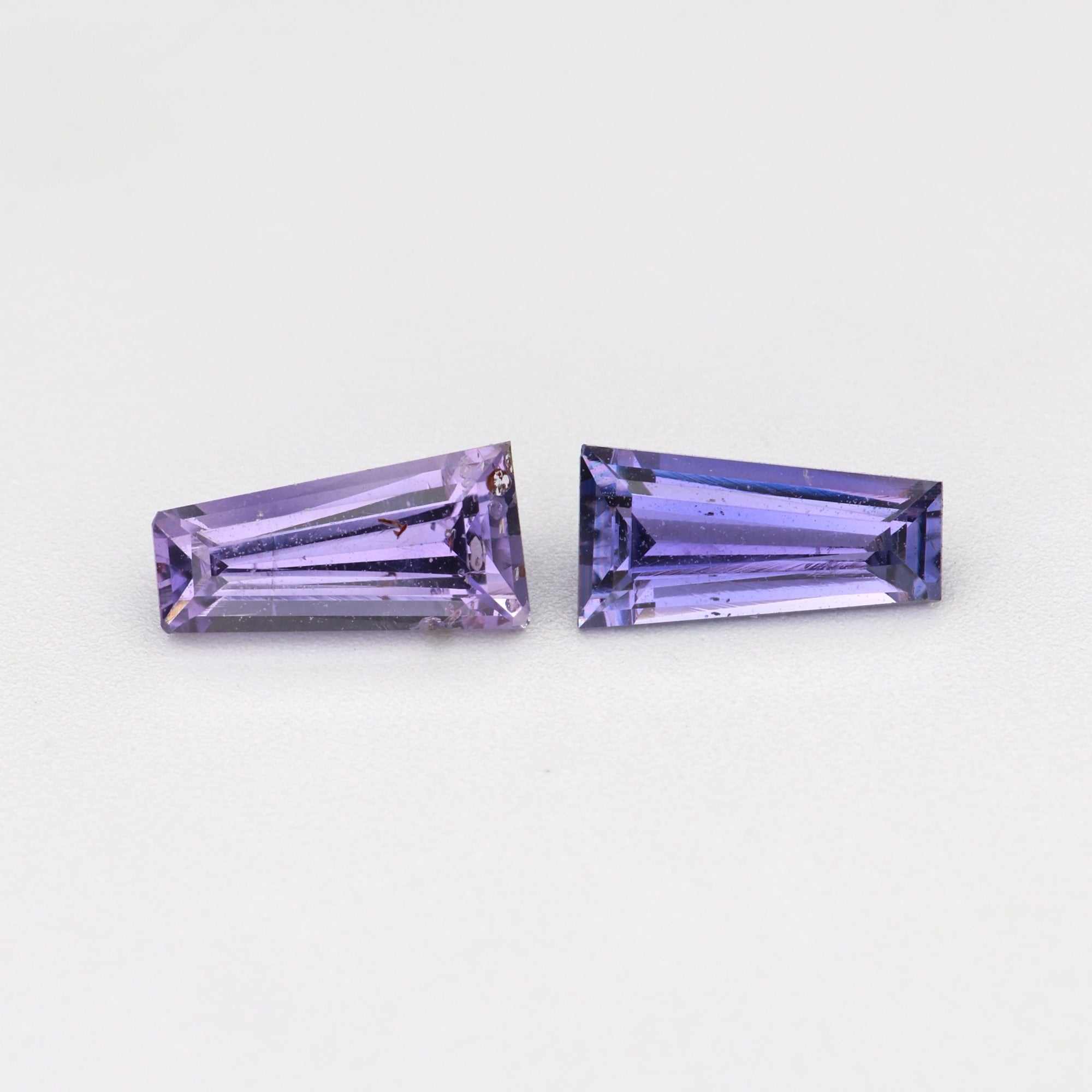 0.69 ctw tapered baguette purple sapphire matched pair showing purple color and clarity
