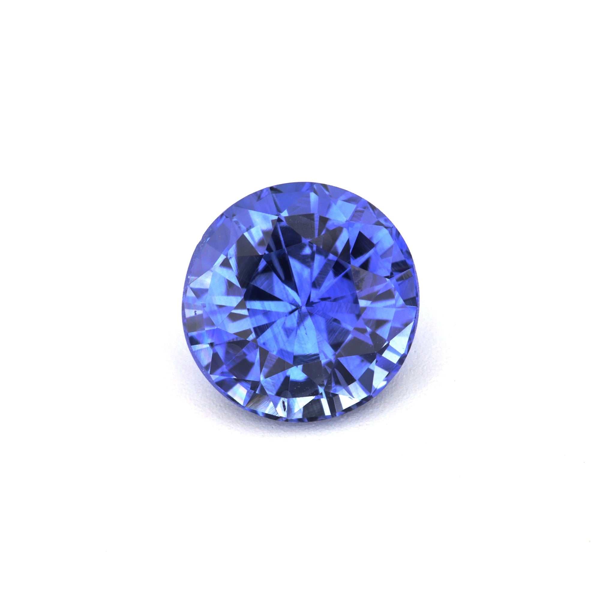 Brilliant 1.62 Ct round-cut blue sapphire gemstone with deep Ceylon blue color and excellent clarity
