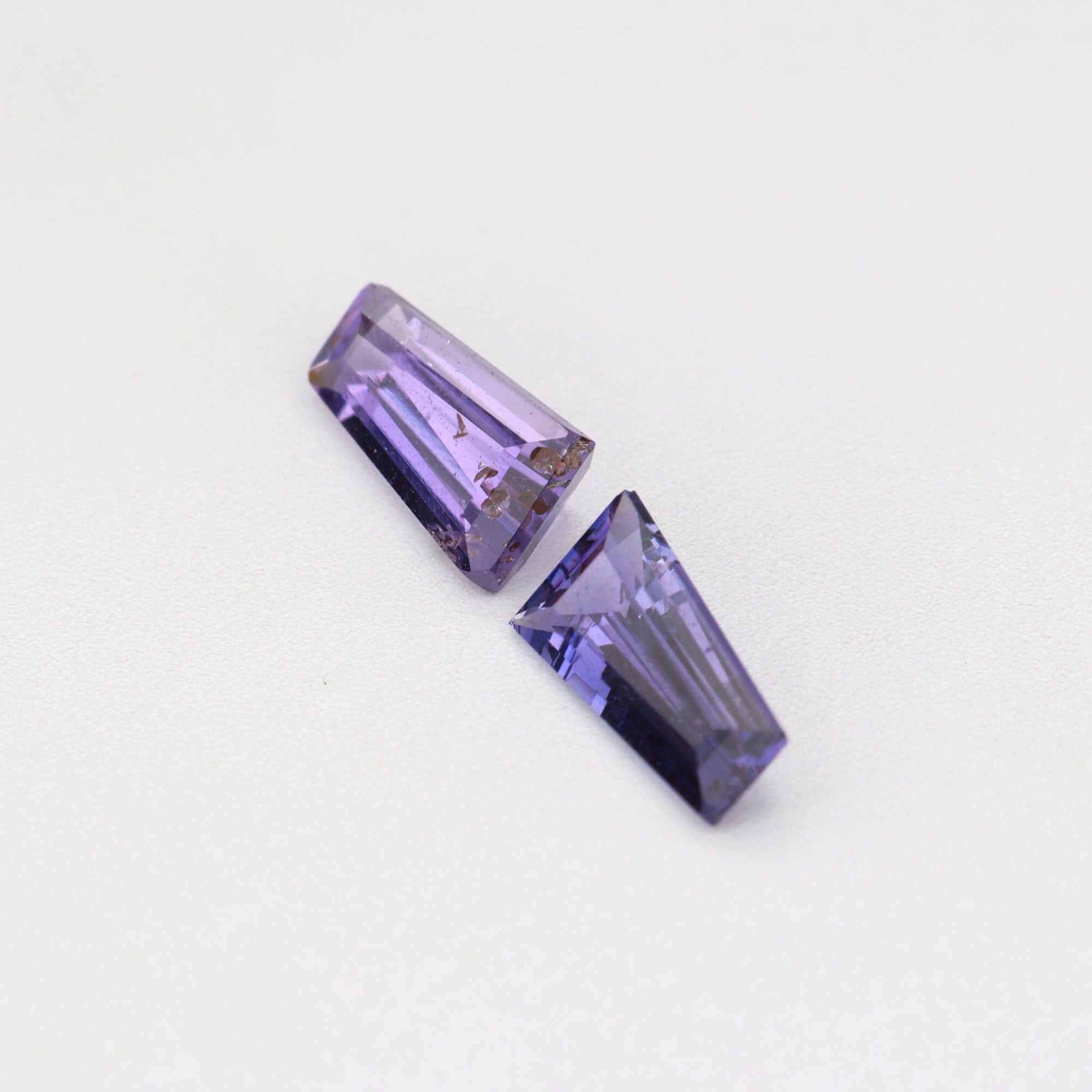 0.69 ctw tapered baguette purple sapphire pair showing matched cut and transparency