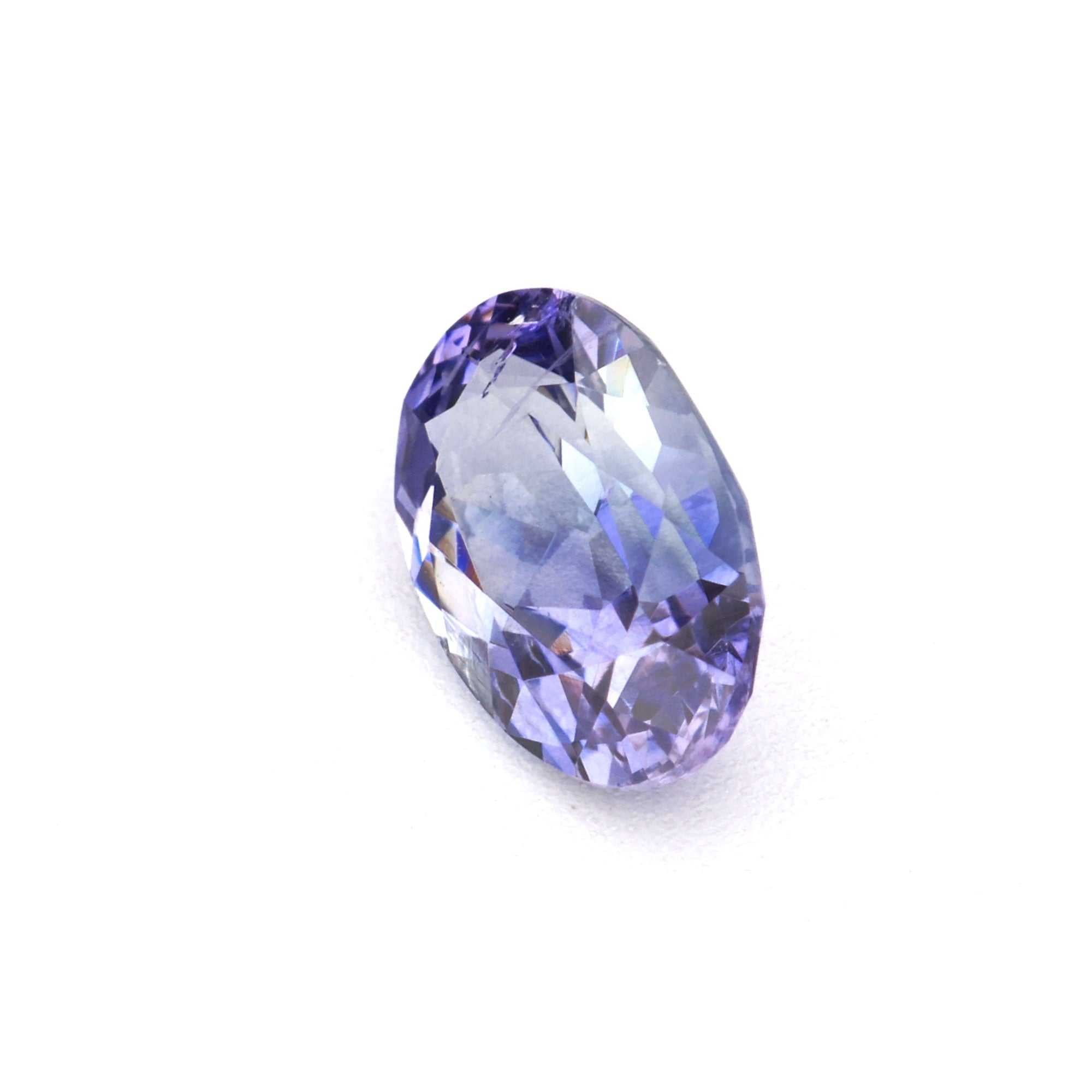0.56 ct natural Ceylon purple sapphire gemstone with brilliant violet hue and precision cut