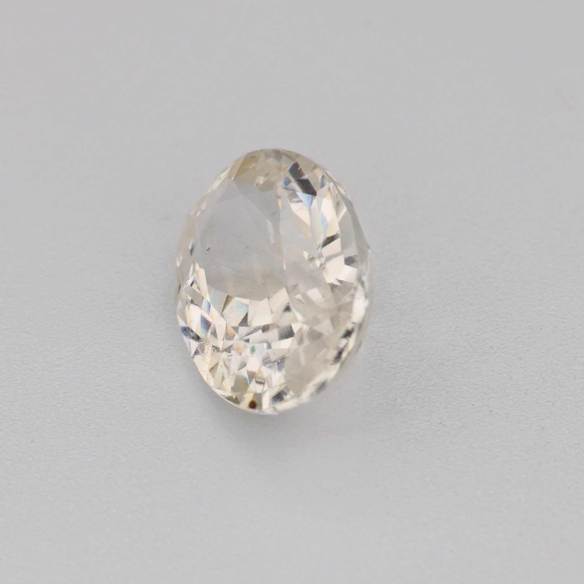 0.95ct 7x5mm oval white sapphire gemstone with exceptional clarity and brilliance for fine jewelry