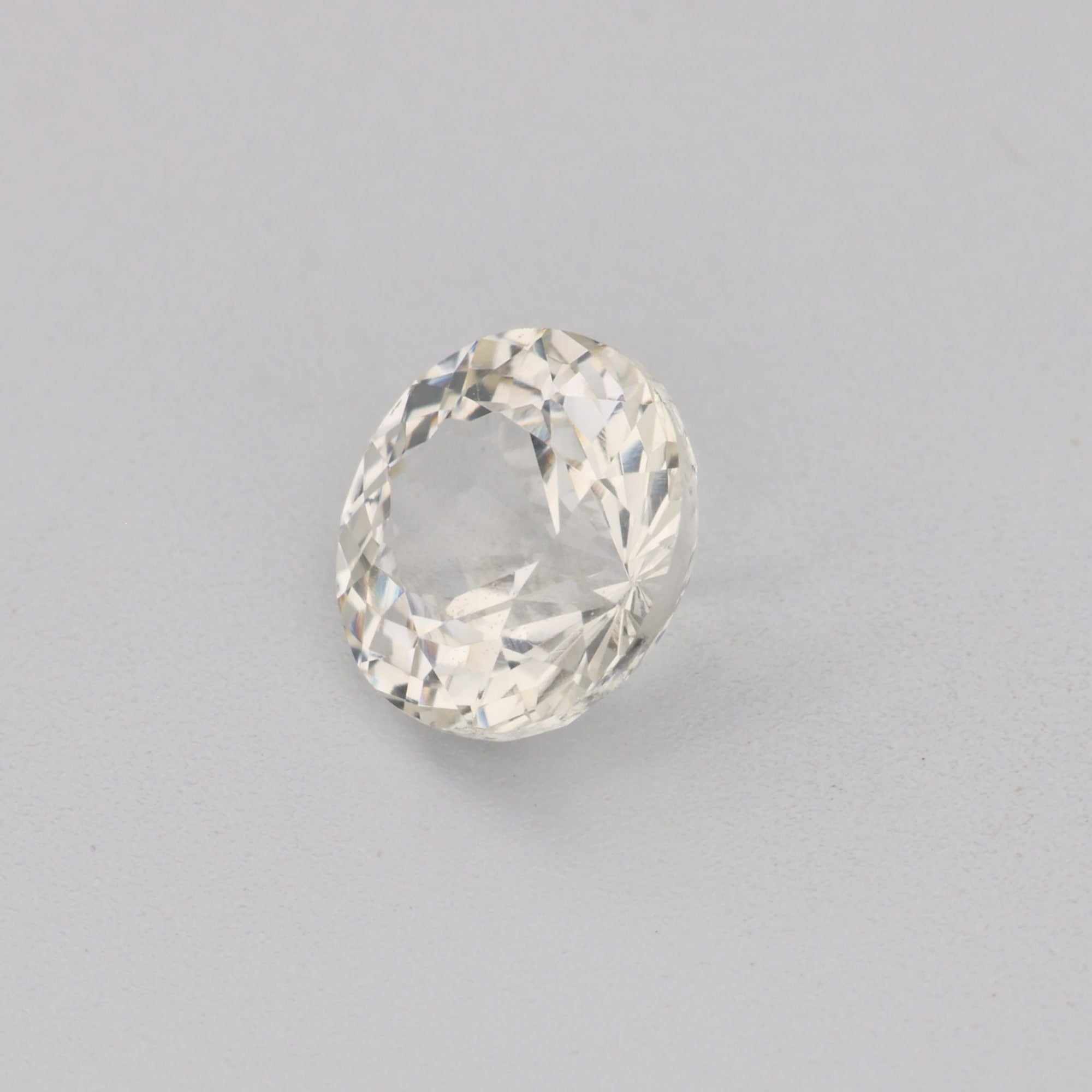0.68ct 5mm round precision-cut white sapphire gemstone with brilliant sparkle and durability