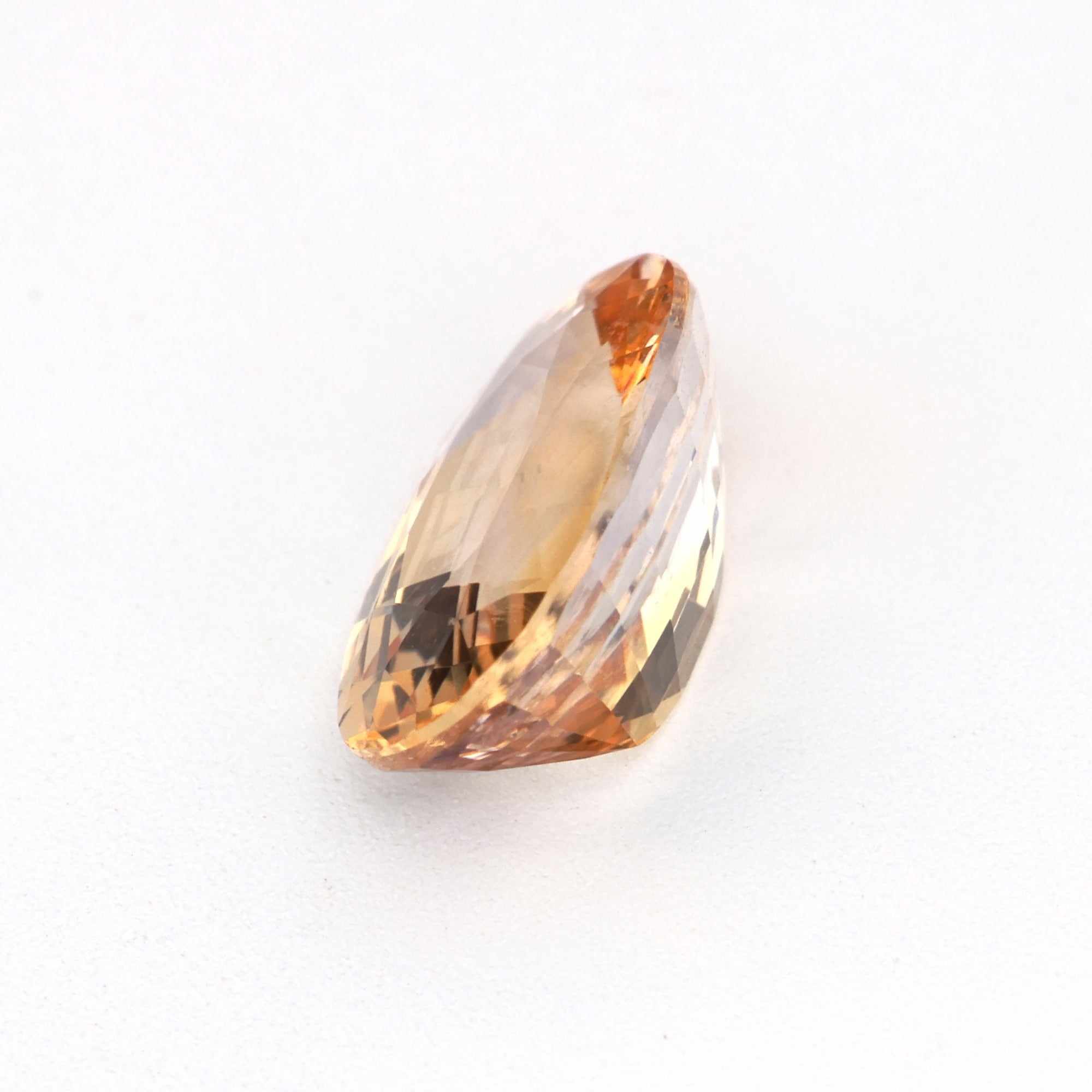 1.18ct unheated peach sapphire gemstone with excellent clarity and warm peach hue