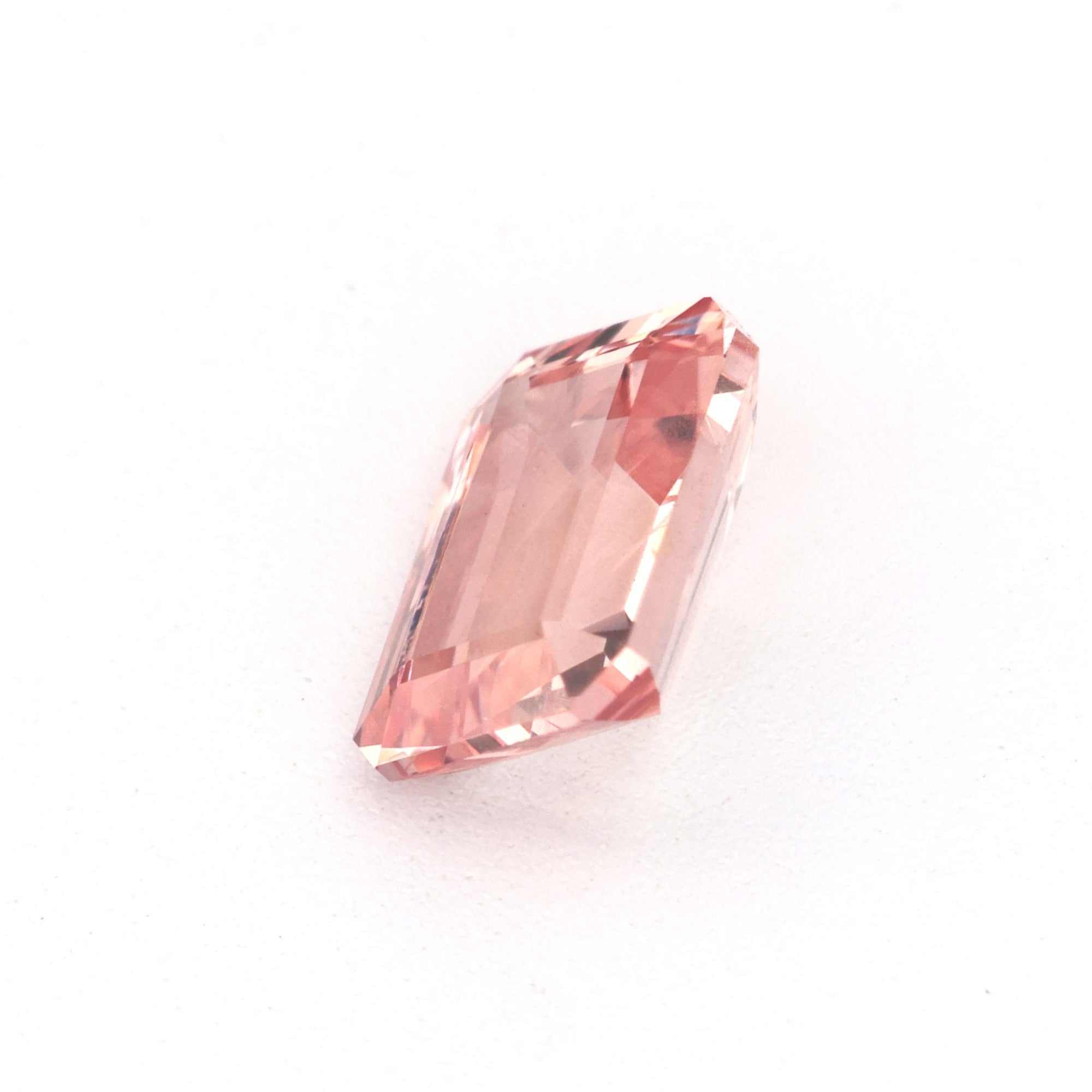 0.61 Ct natural unheated peach sapphire gemstone with excellent clarity and peach hue