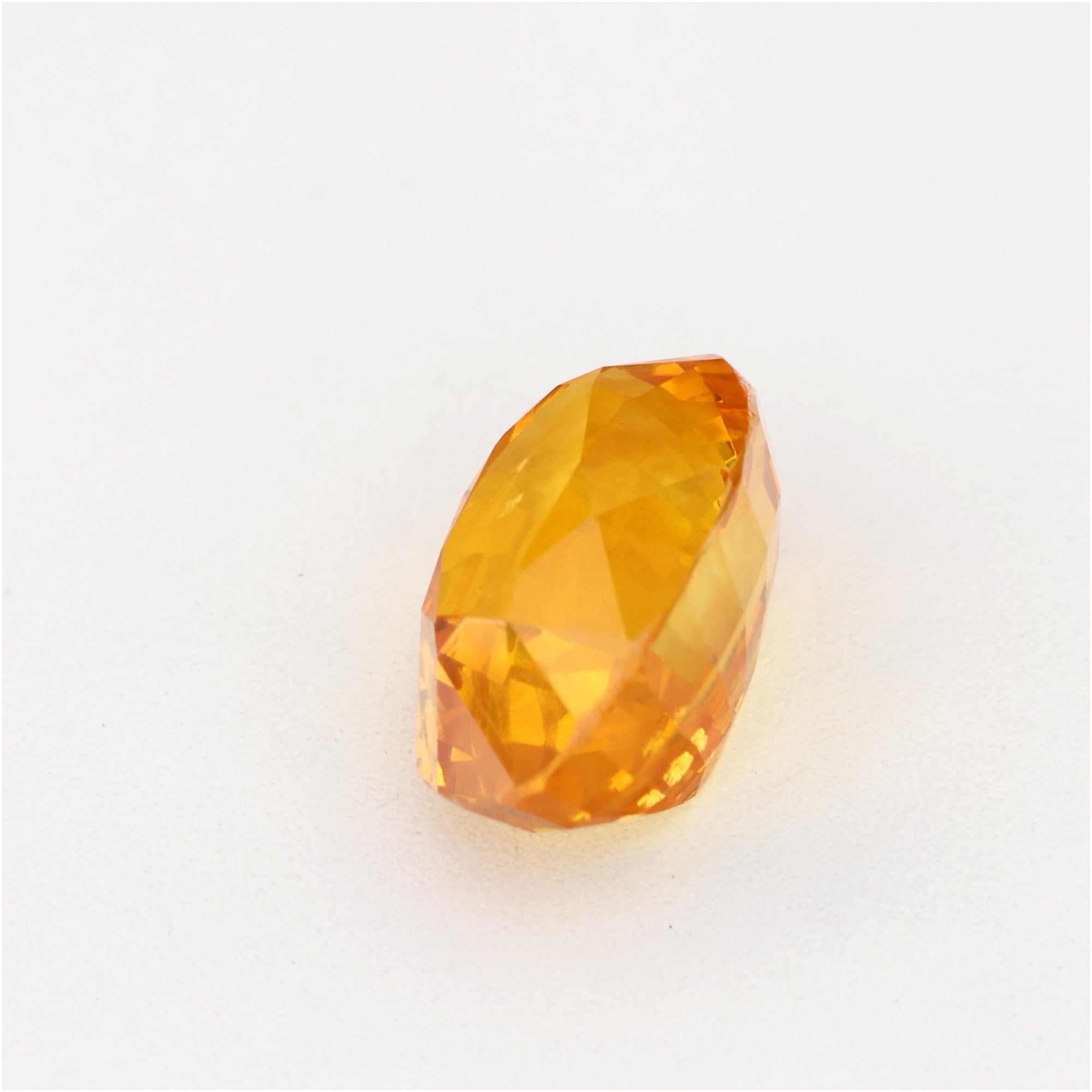 1.34 Ct orange sapphire gemstone with vibrant golden-orange color and clarity