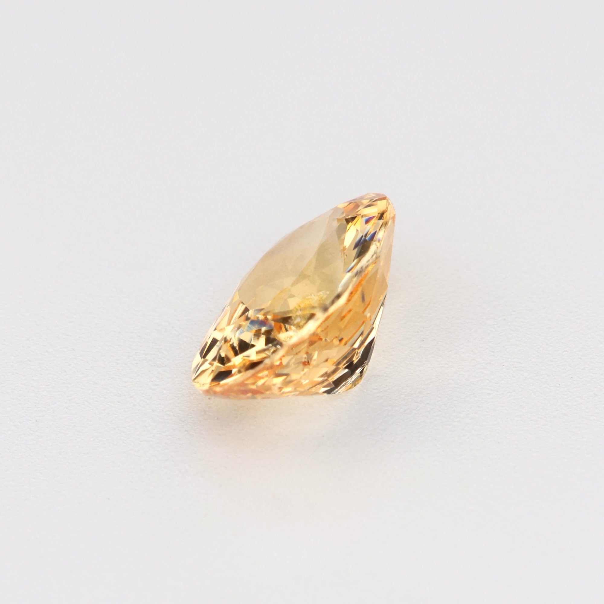 0.81 ct natural peach sapphire gemstone with warm peachy-orange hues and excellent clarity