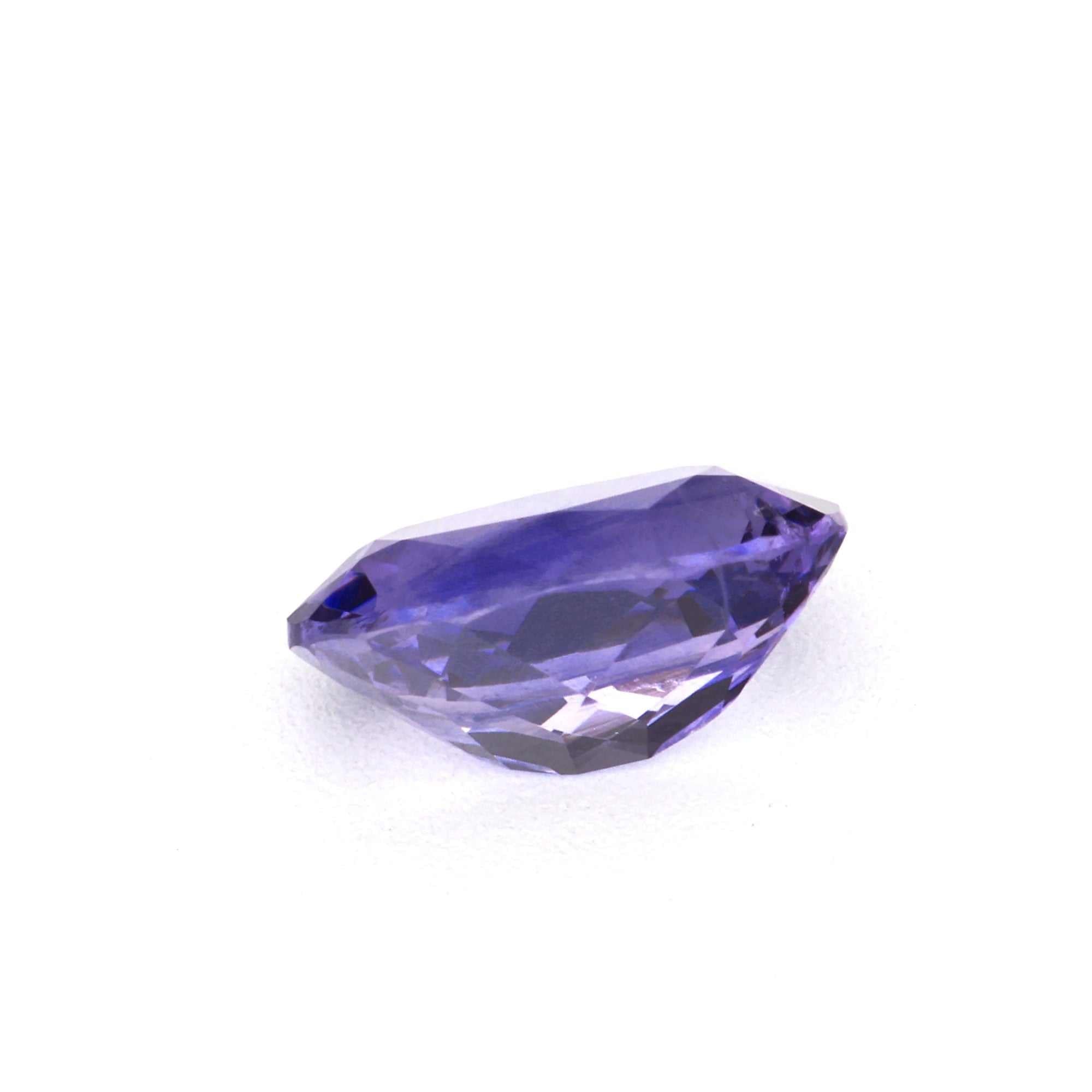 0.56 ct natural Ceylon purple sapphire gemstone with excellent clarity and brilliant cut