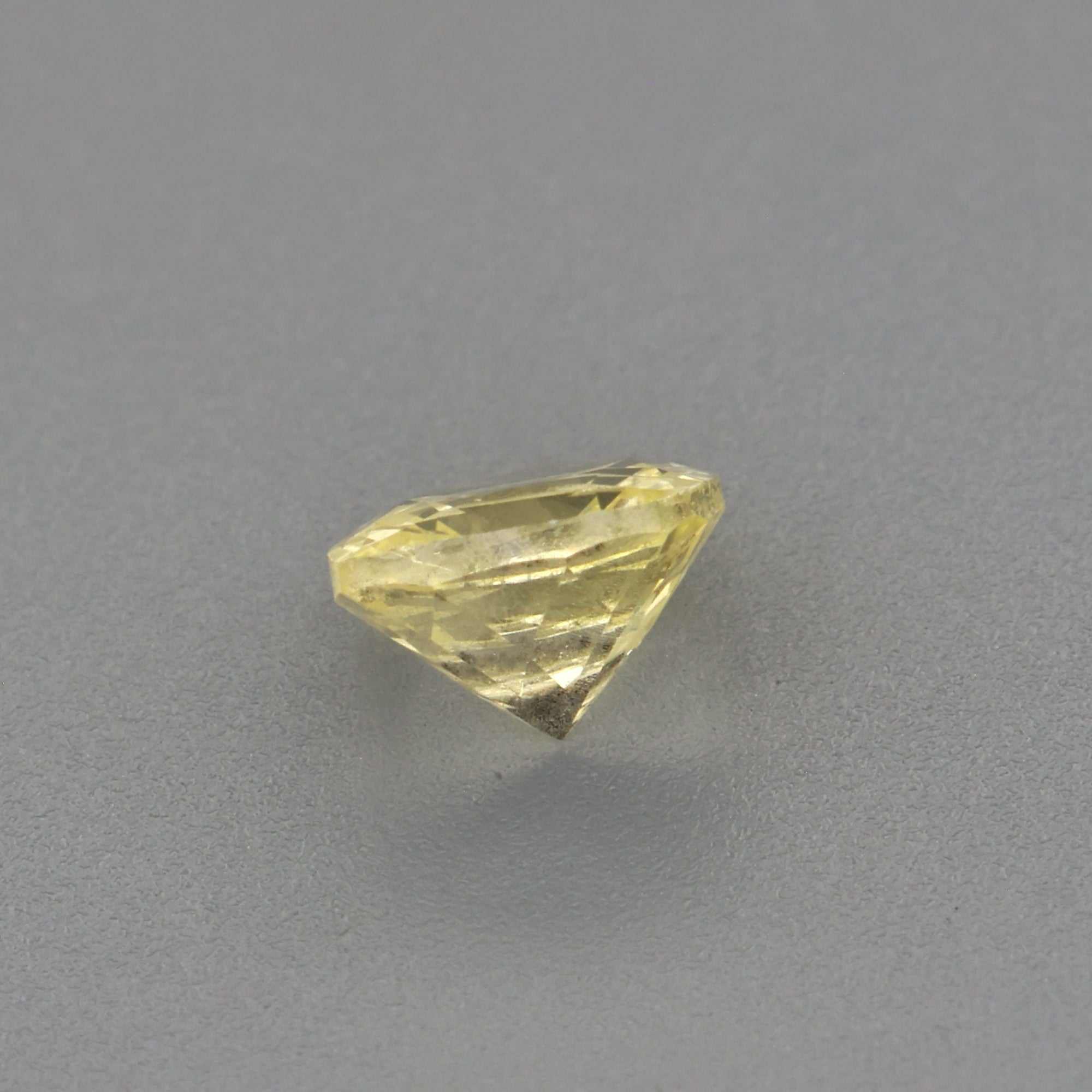 0.36 ct untreated yellow sapphire gemstone with natural golden hue and excellent clarity