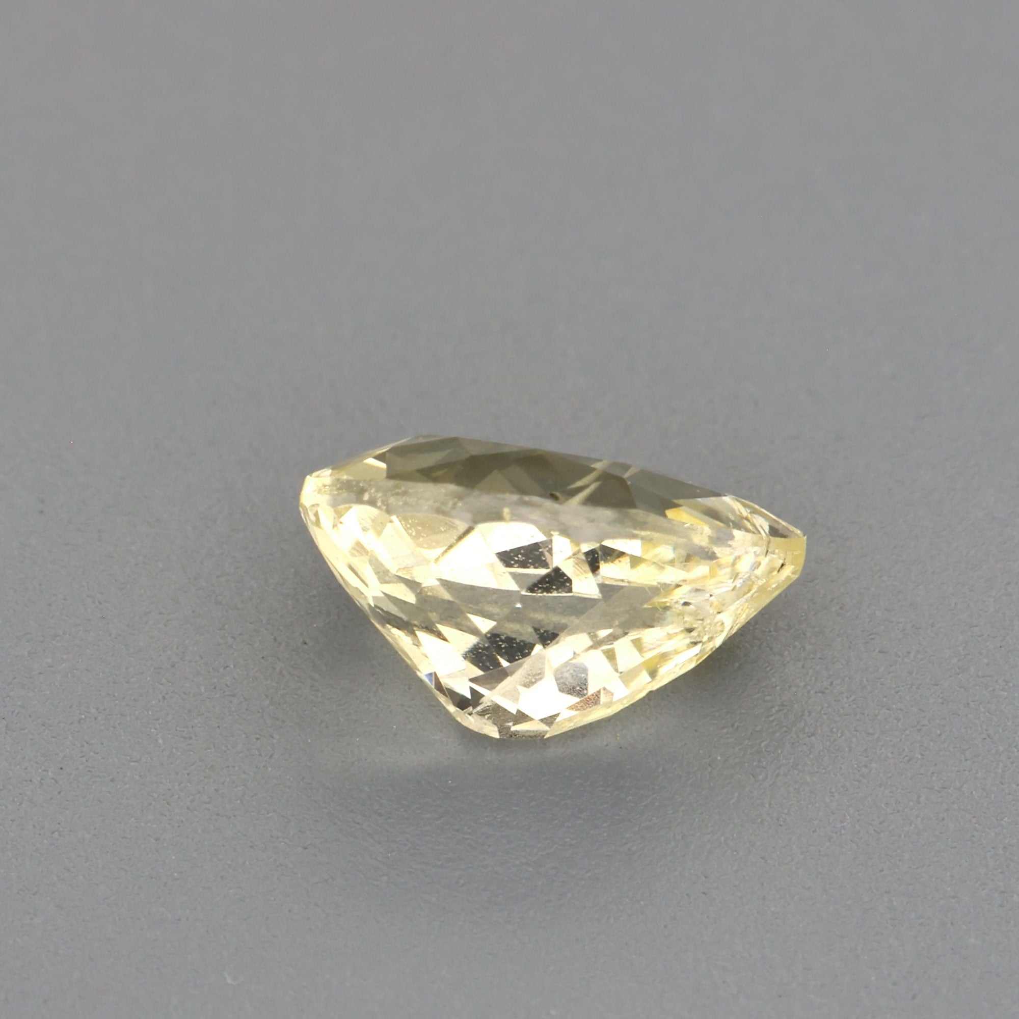 0.61 ct light yellow sapphire pear cut untreated natural gemstone with excellent clarity and brilliance