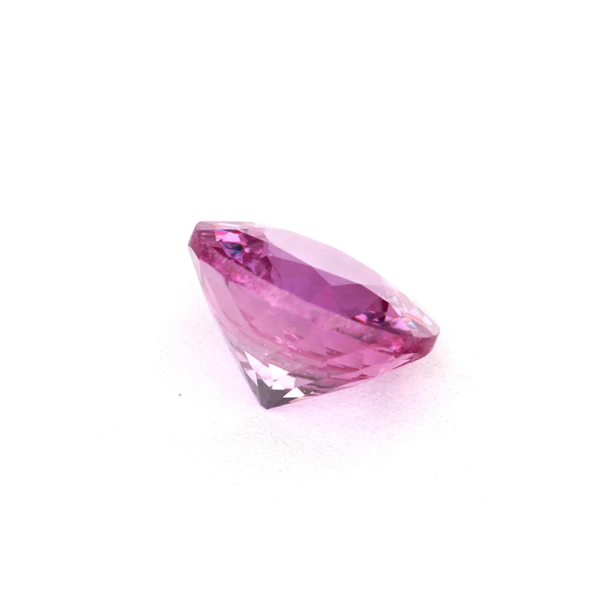 Round 0.62 ct natural pink sapphire gemstone with vivid color and excellent clarity