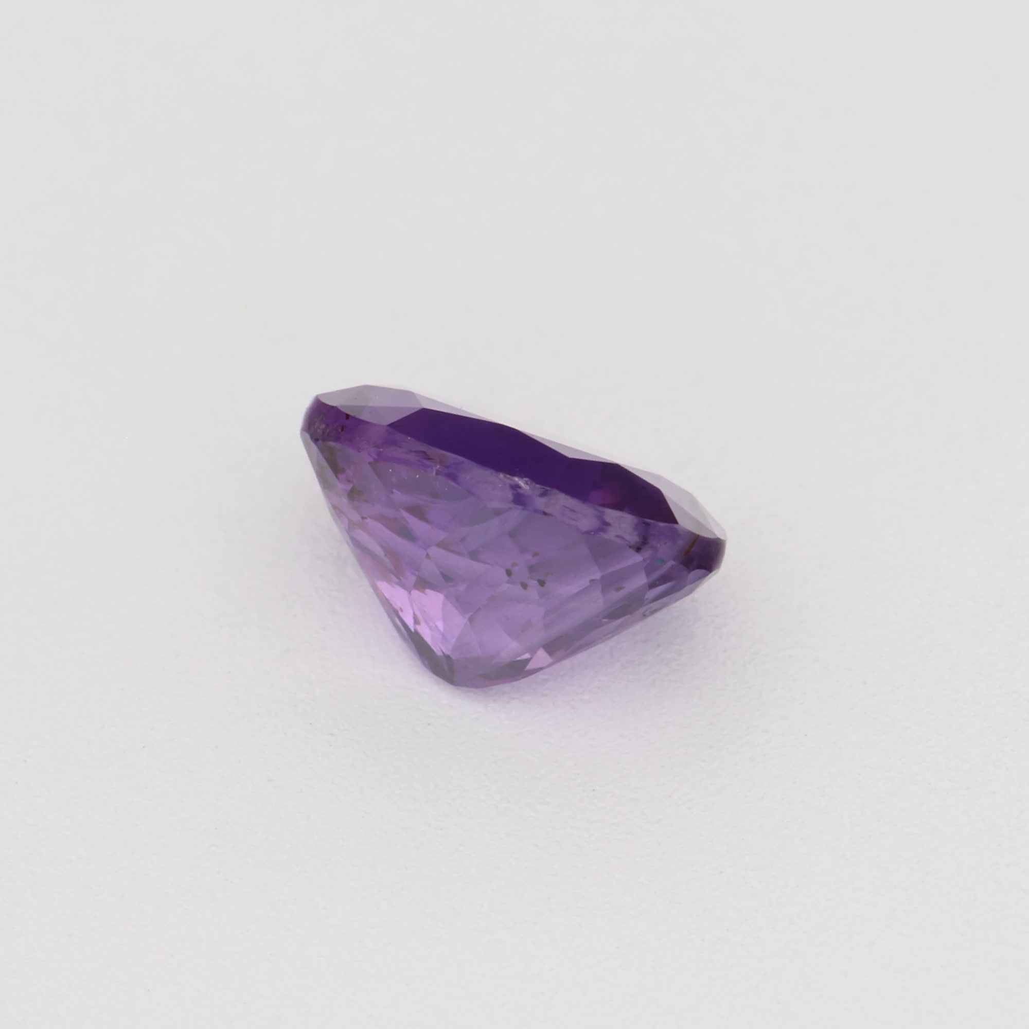 0.58 ct vibrant untreated violet sapphire gemstone with rich purple hue and precision cut for jewelry