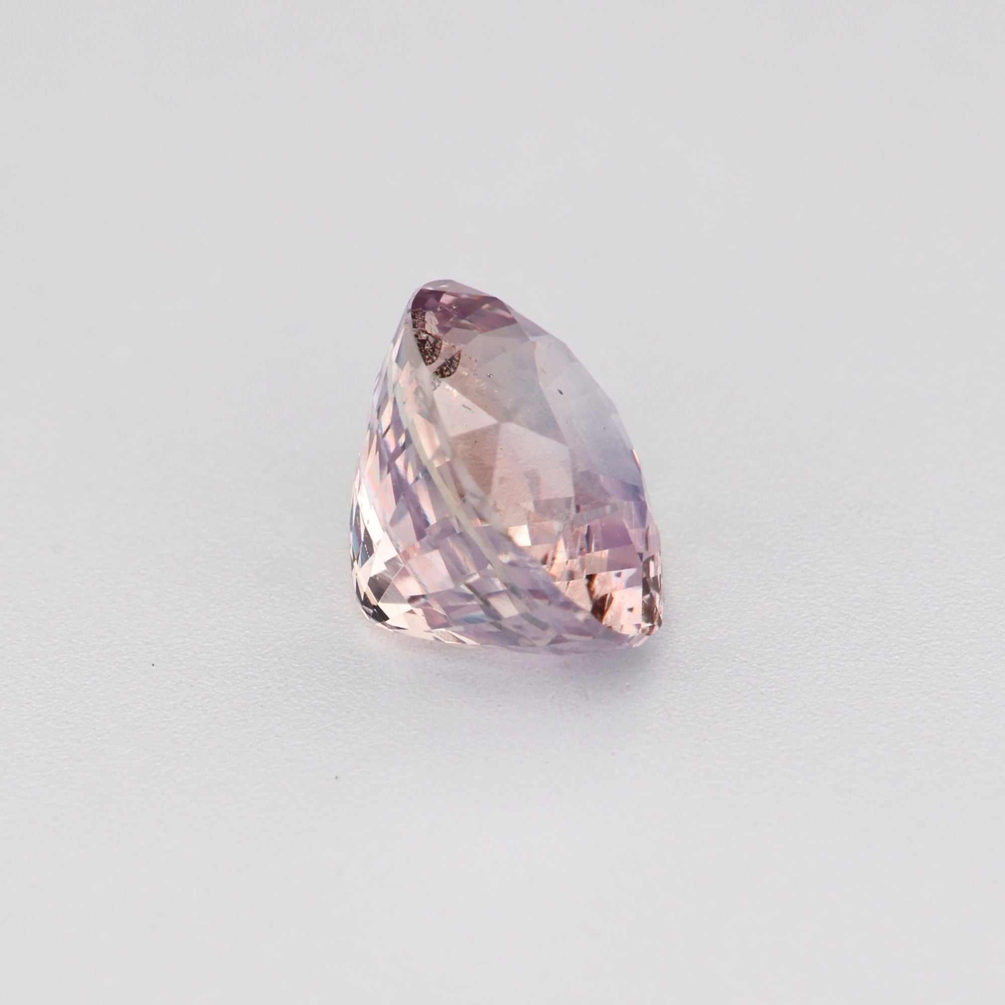 1.12 ct natural unheated peach sapphire gemstone with oval cut and excellent clarity