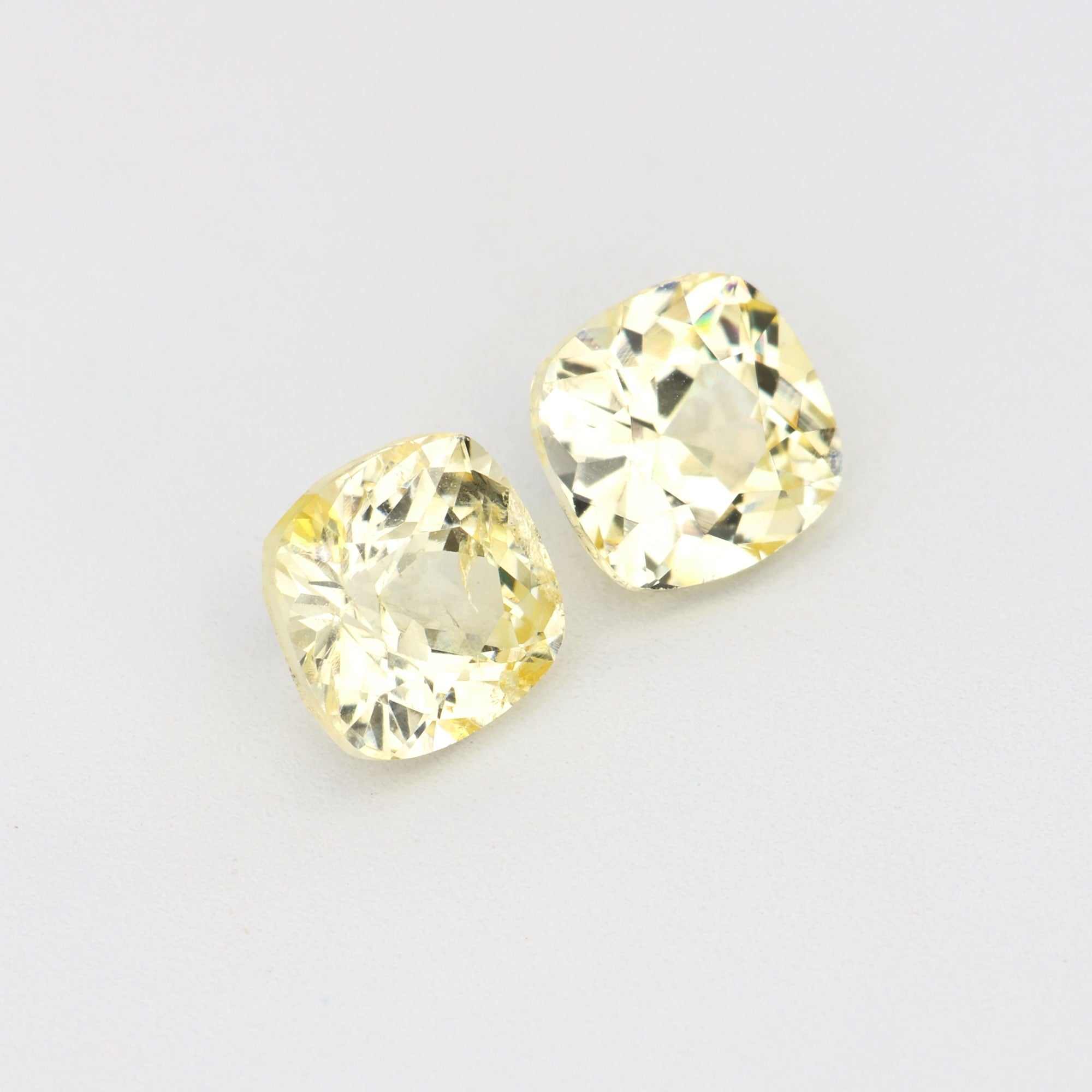 Pair of 1.11 ct unheated yellow sapphires with natural clarity and golden hue