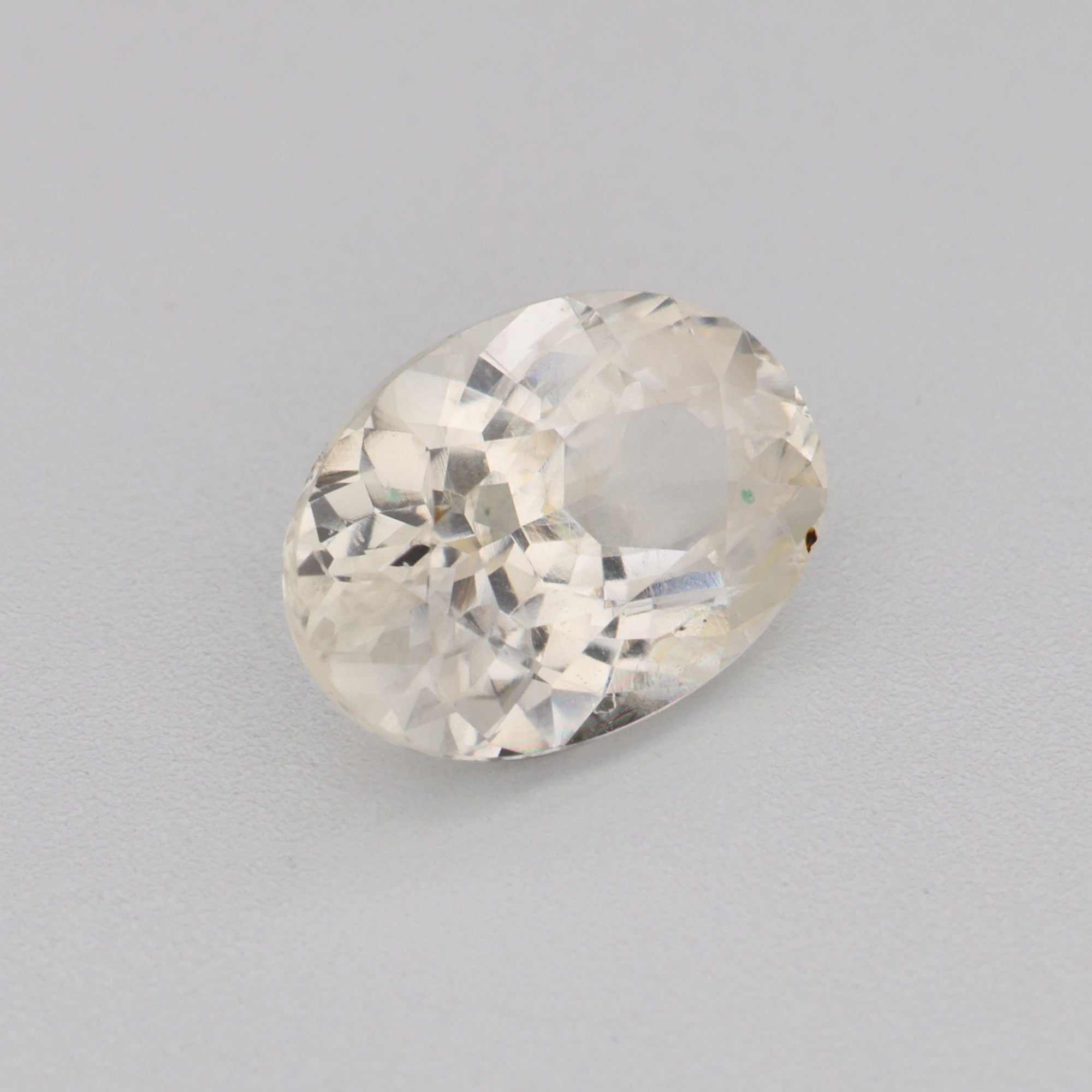 0.95ct 7x5mm oval white sapphire gemstone with exceptional clarity and brilliance for fine jewelry