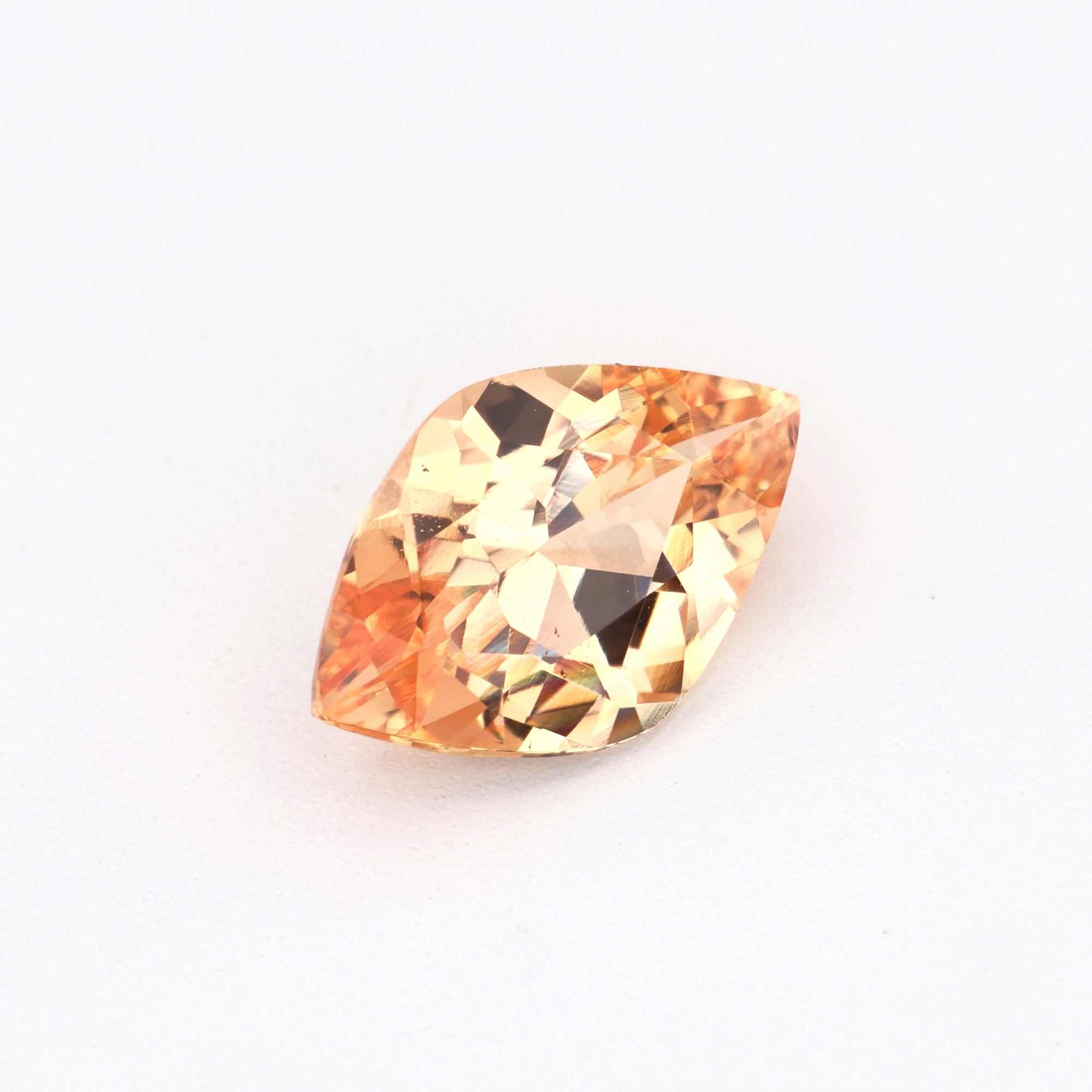 0.79 ct unheated peach sapphire gemstone with excellent clarity and soft peach hue for fine jewelry designs