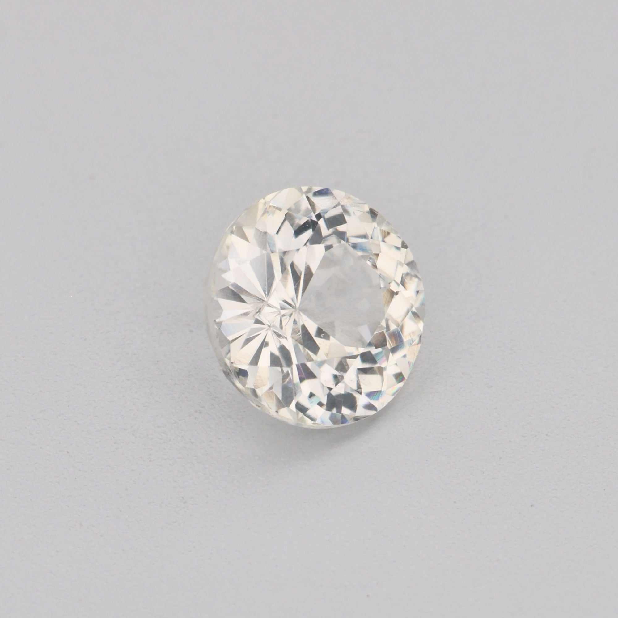 0.68ct 5mm round white sapphire gemstone with brilliant sparkle and precision cut