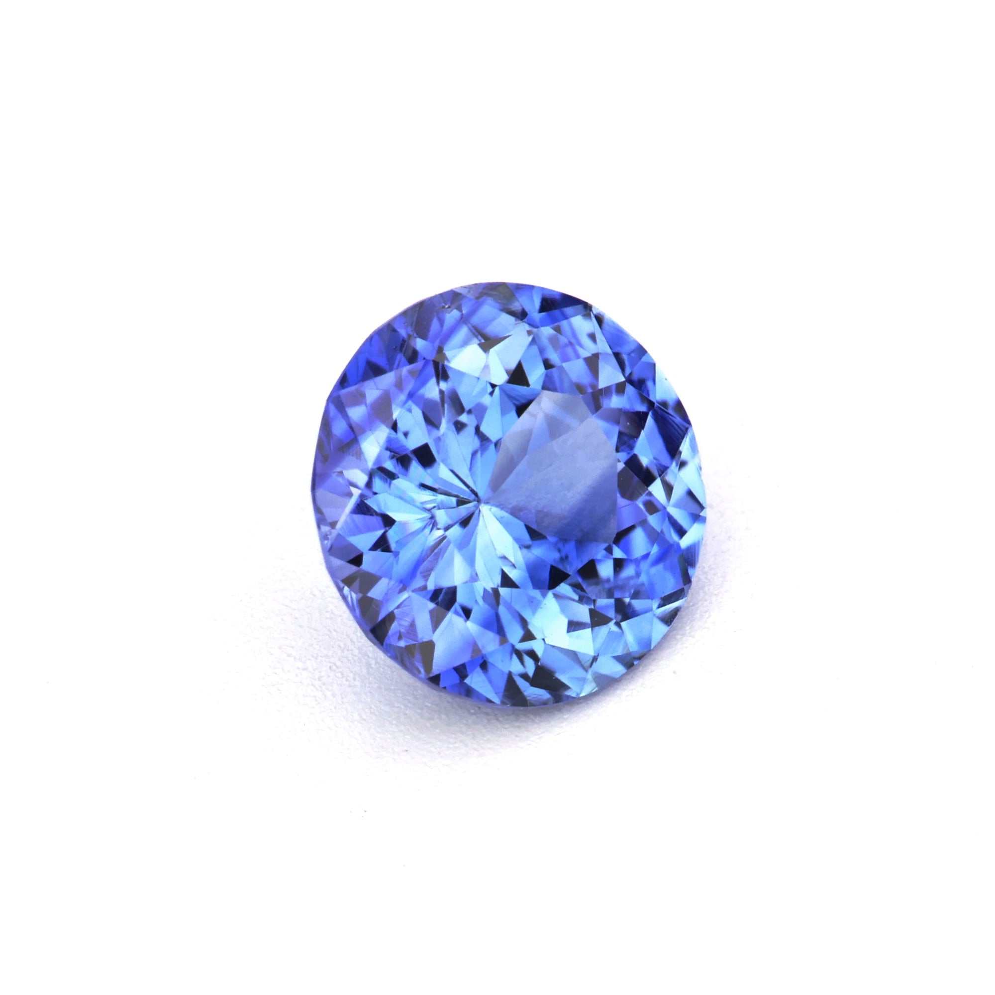 0.87 ct natural Ceylon round blue sapphire gemstone with brilliant cut and deep blue color