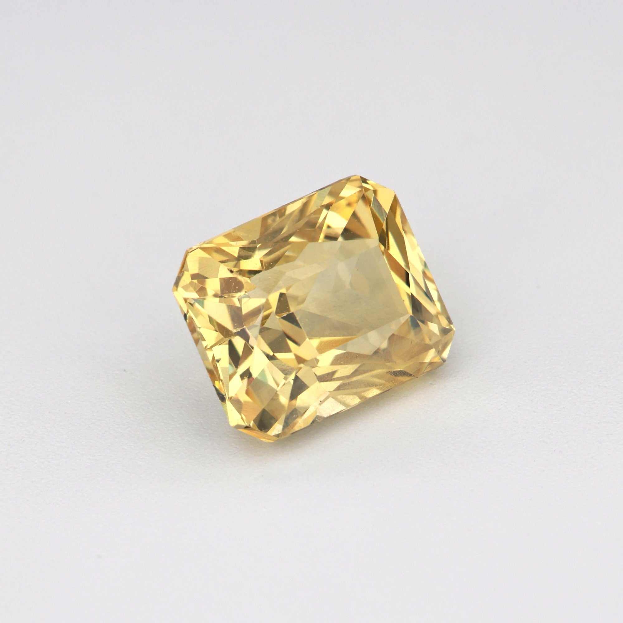 1.66ct unheated yellow sapphire gemstone with natural golden hue and excellent clarity