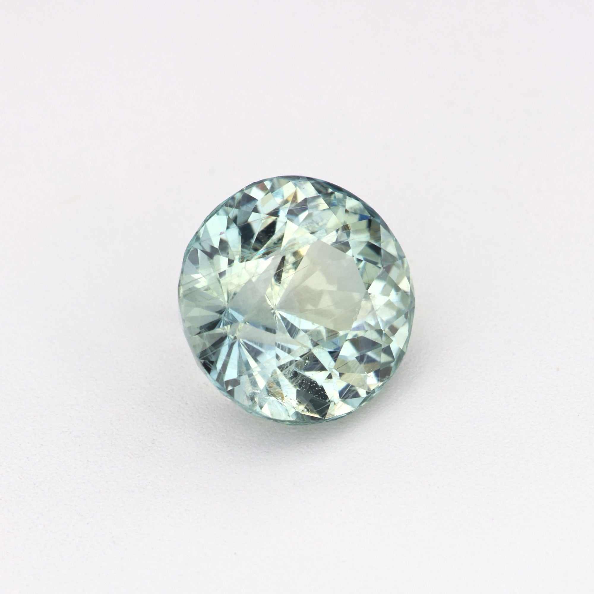 Close-up of 1.70 ct unheated green sapphire gemstone with brilliant natural green hue and excellent clarity