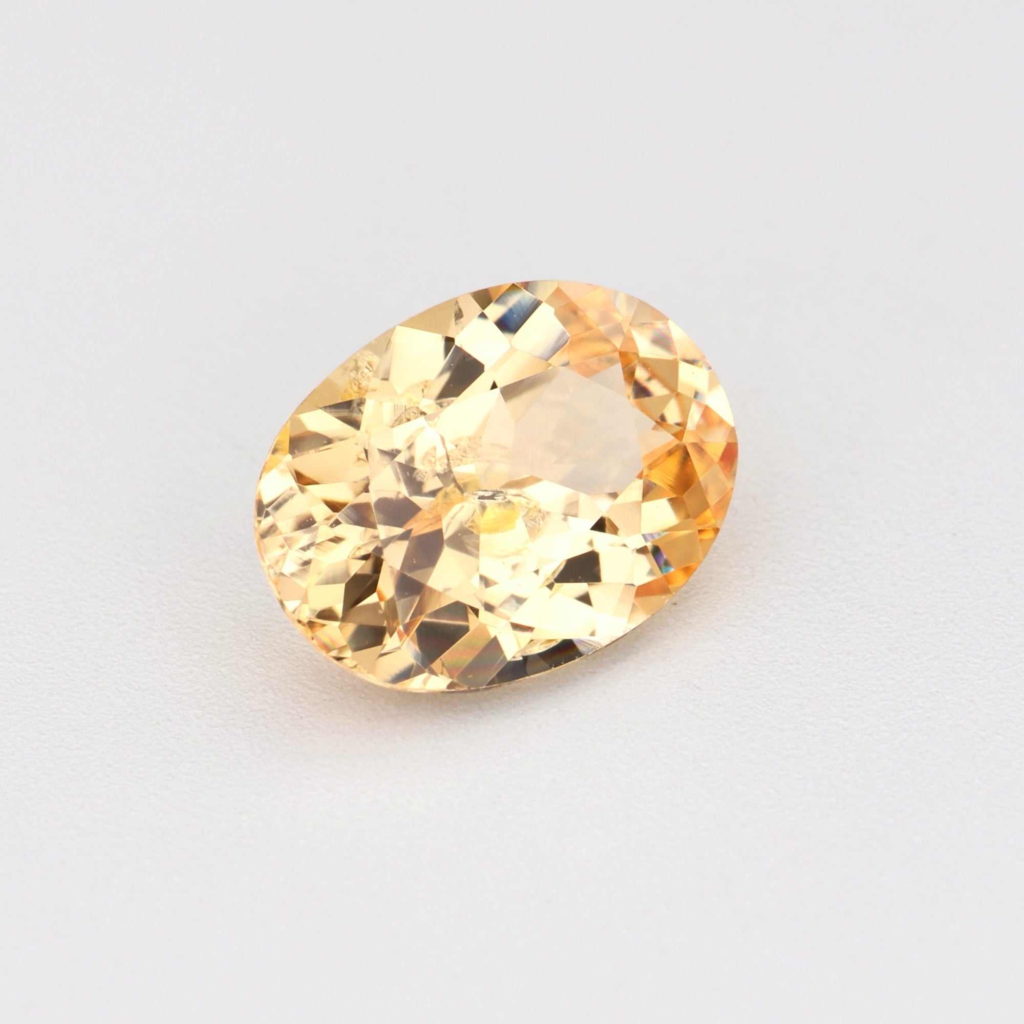 0.81 ct natural unheated peach sapphire gemstone with warm peachy-orange hues and excellent clarity