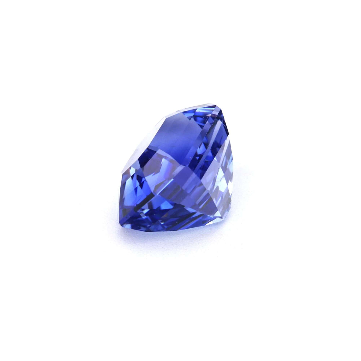 3.08 ct step cut natural Ceylon blue sapphire gemstone with excellent clarity and deep blue color