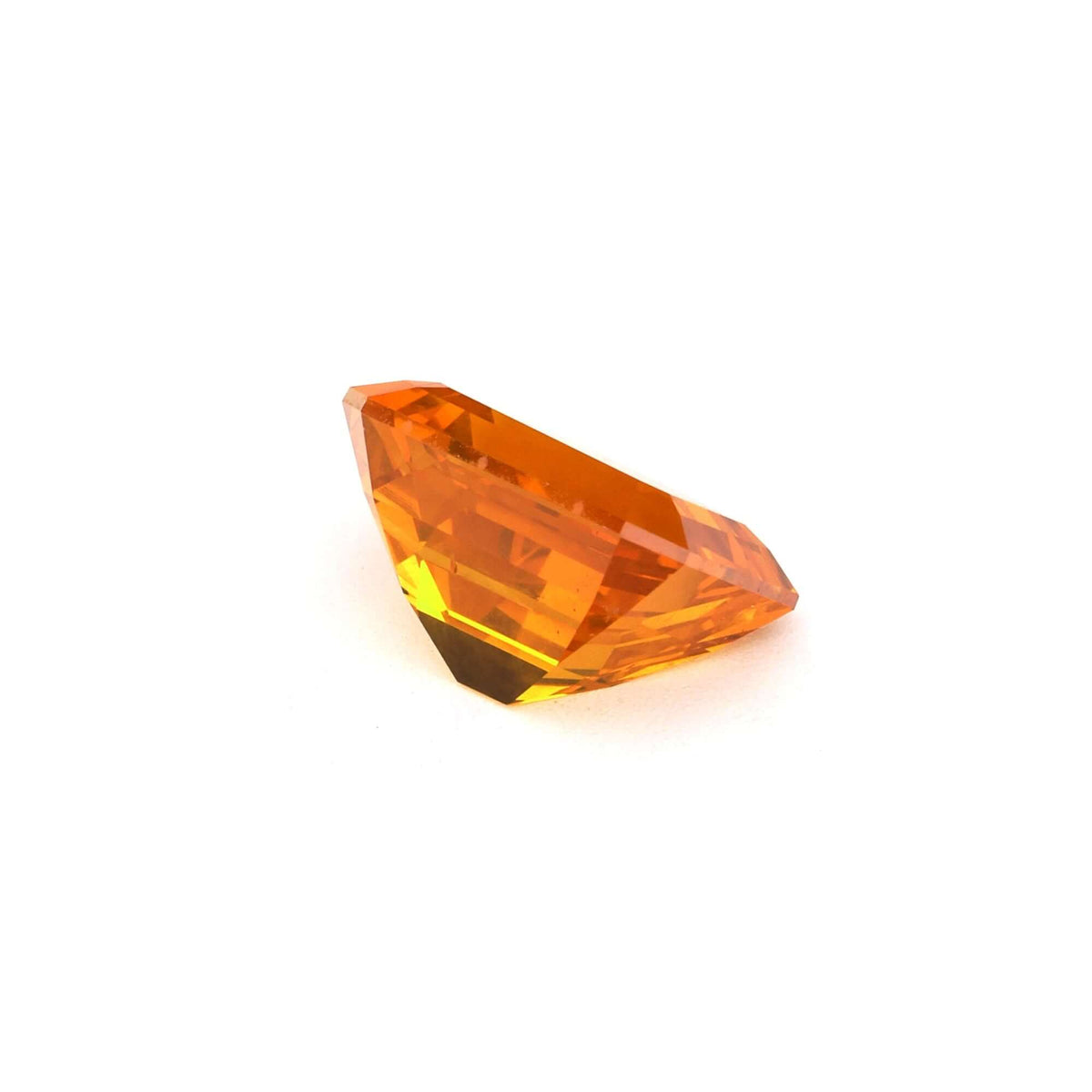 3.09 ct Emerald-Cut Orange Sapphire showcasing vivid orange hues and brilliant facets.