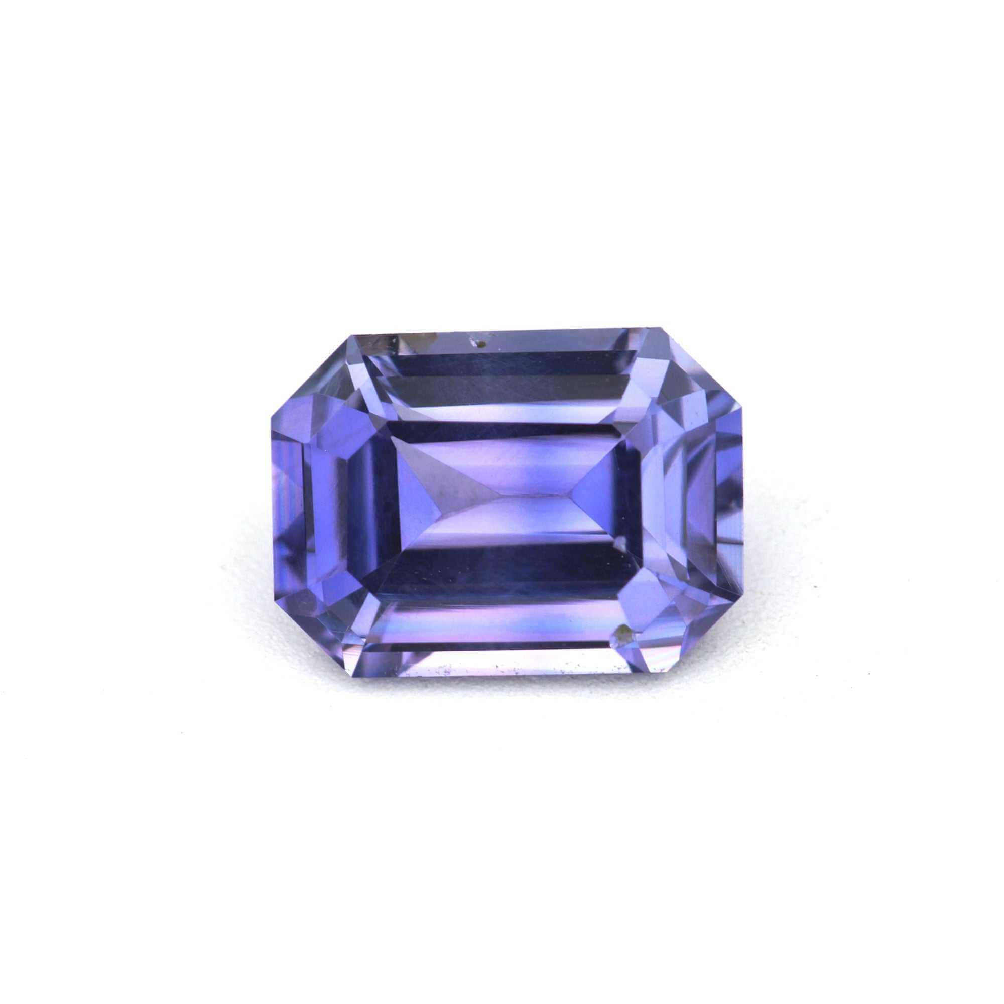 1.10 ct emerald cut unheated violet sapphire gemstone with soft violet hue and clarity