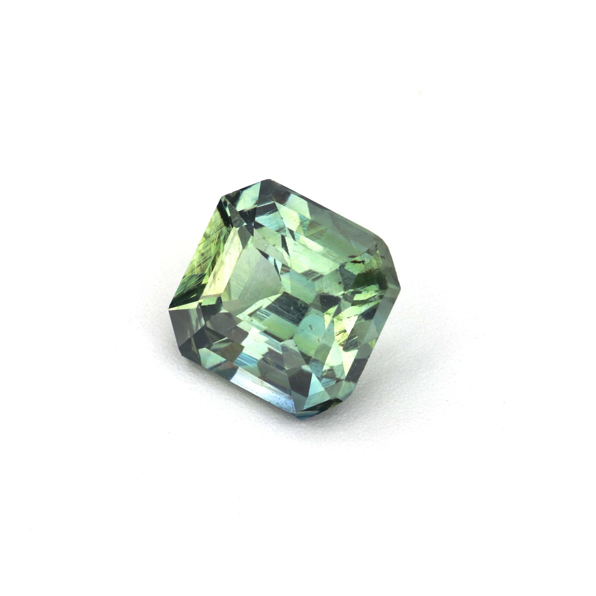 Asscher green sapphire showing step-cut facets and natural green hue — 1.17 carat Ceylon stone