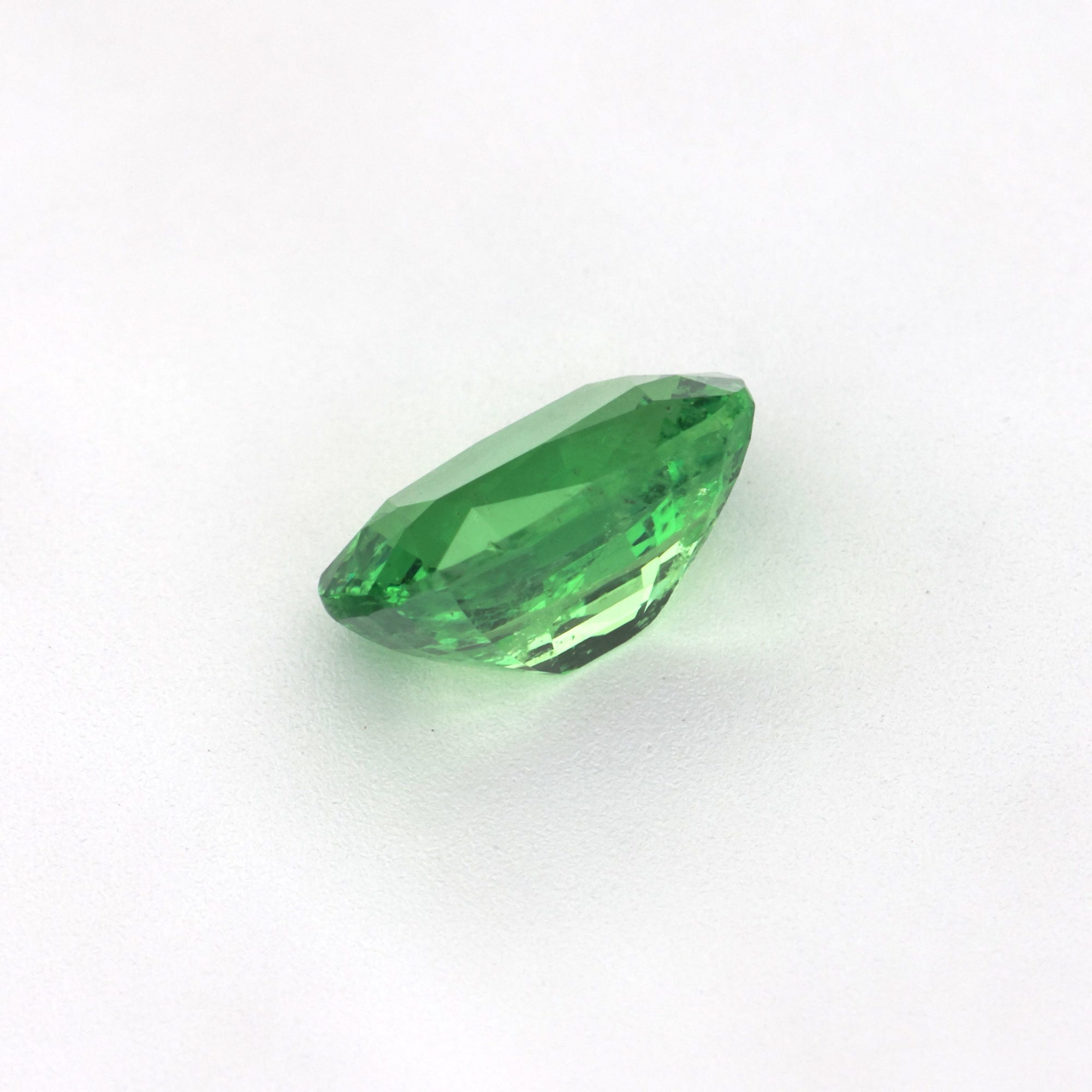 1.06 ct Cushion Tsavorite Garnet gemstone showcasing vivid green color and cushion cut design.