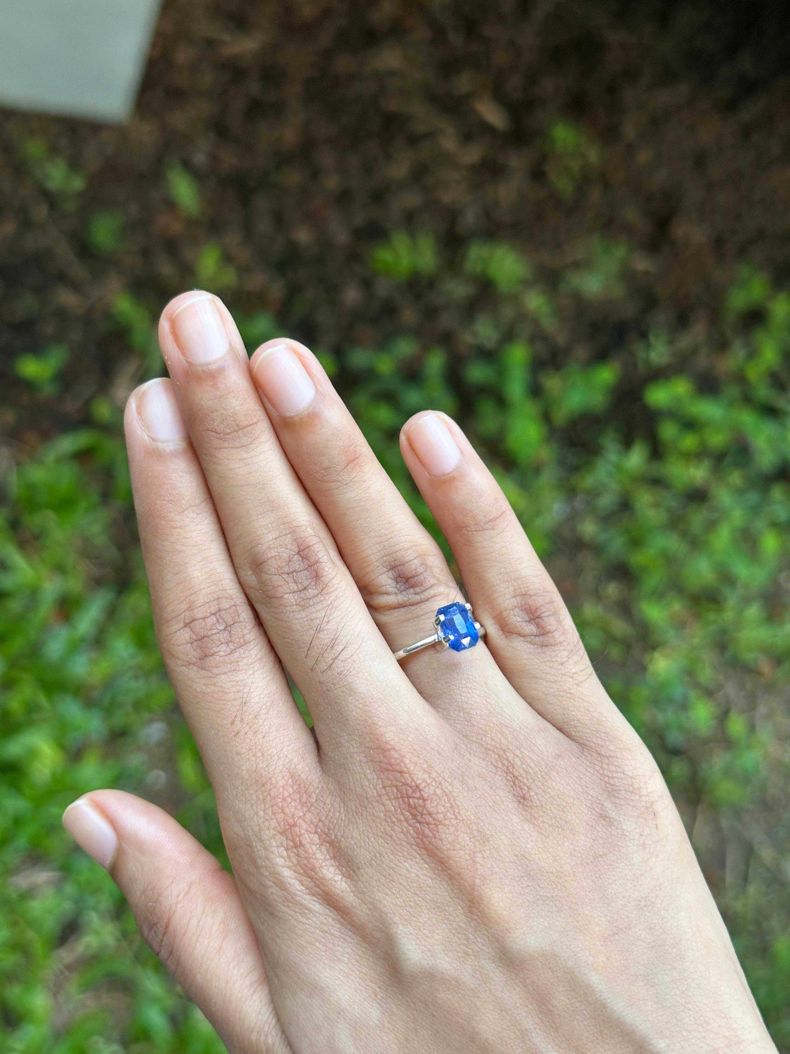 2.008 ct unheated blue Ceylon sapphire ring shown worn on hand