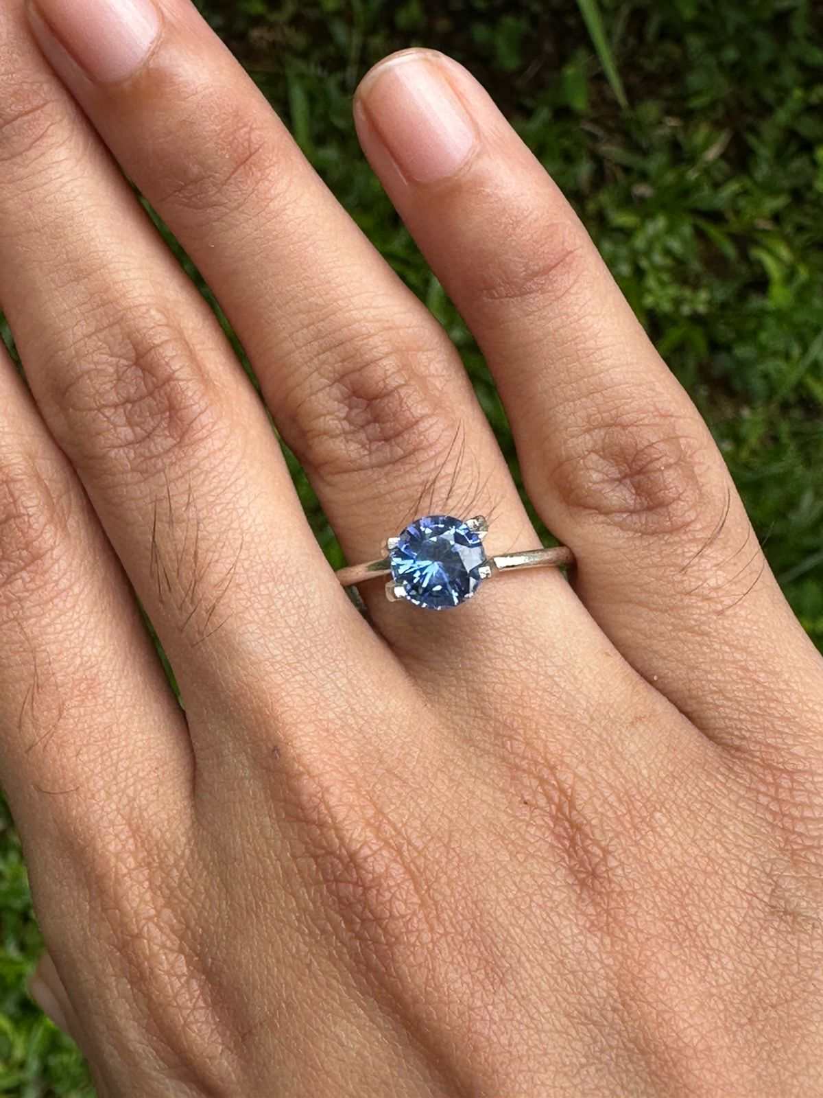1.62 Ct round-cut blue sapphire gemstone with deep Ceylon blue color and excellent clarity