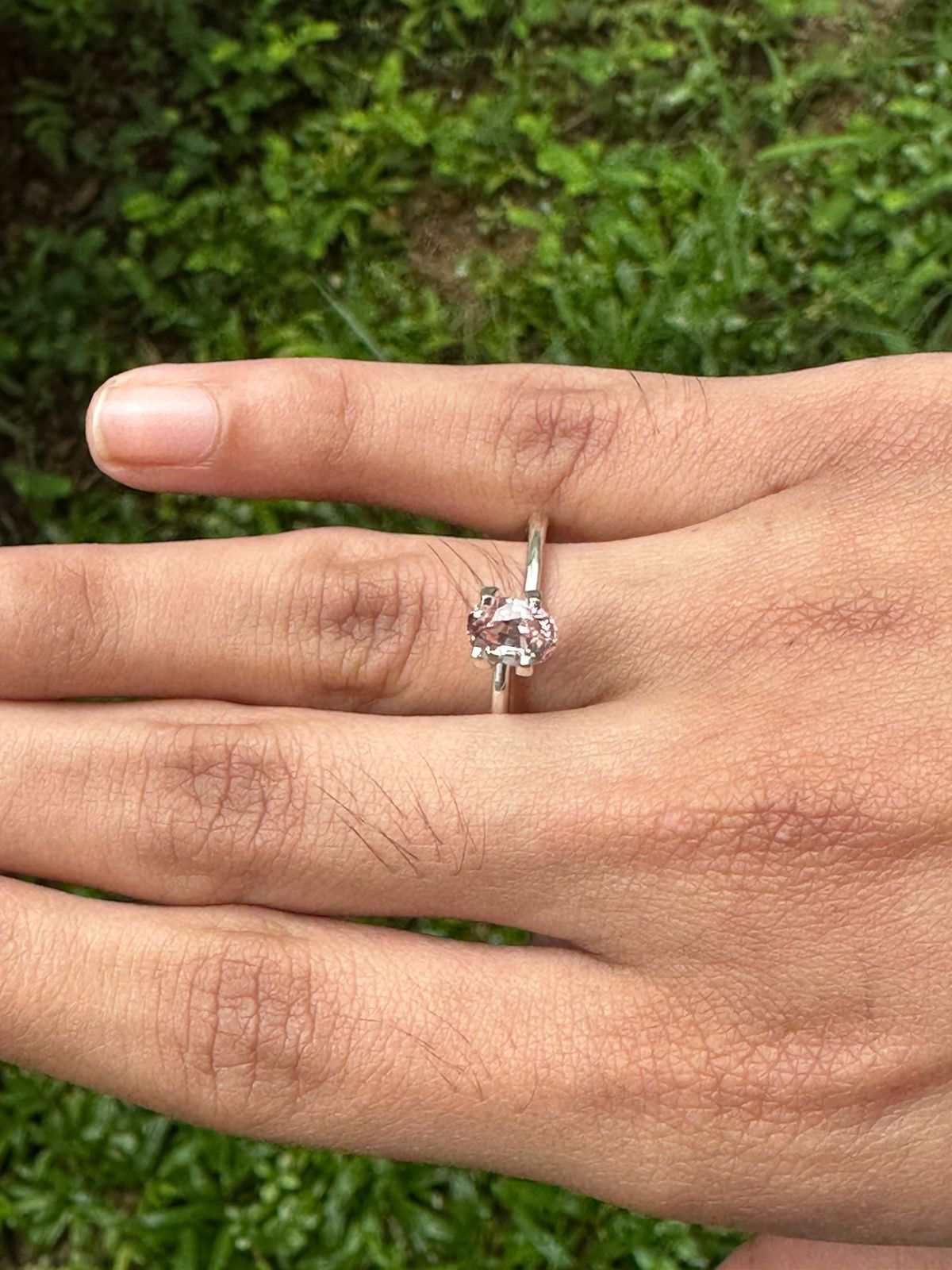 1.23 ct peach sapphire gemstone with warm soft peach hue and brilliant sparkle
