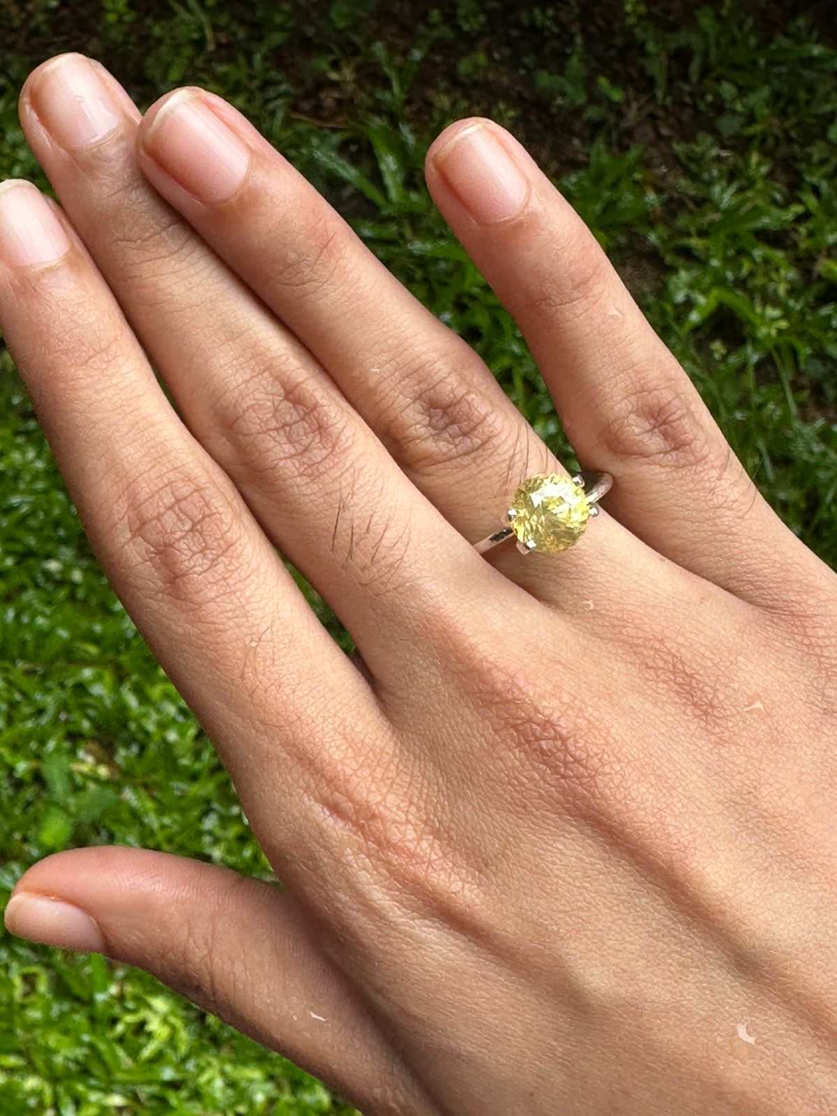 3.13 ct unheated natural yellow sapphire round brilliant cut gemstone with excellent clarity and warm golden hue