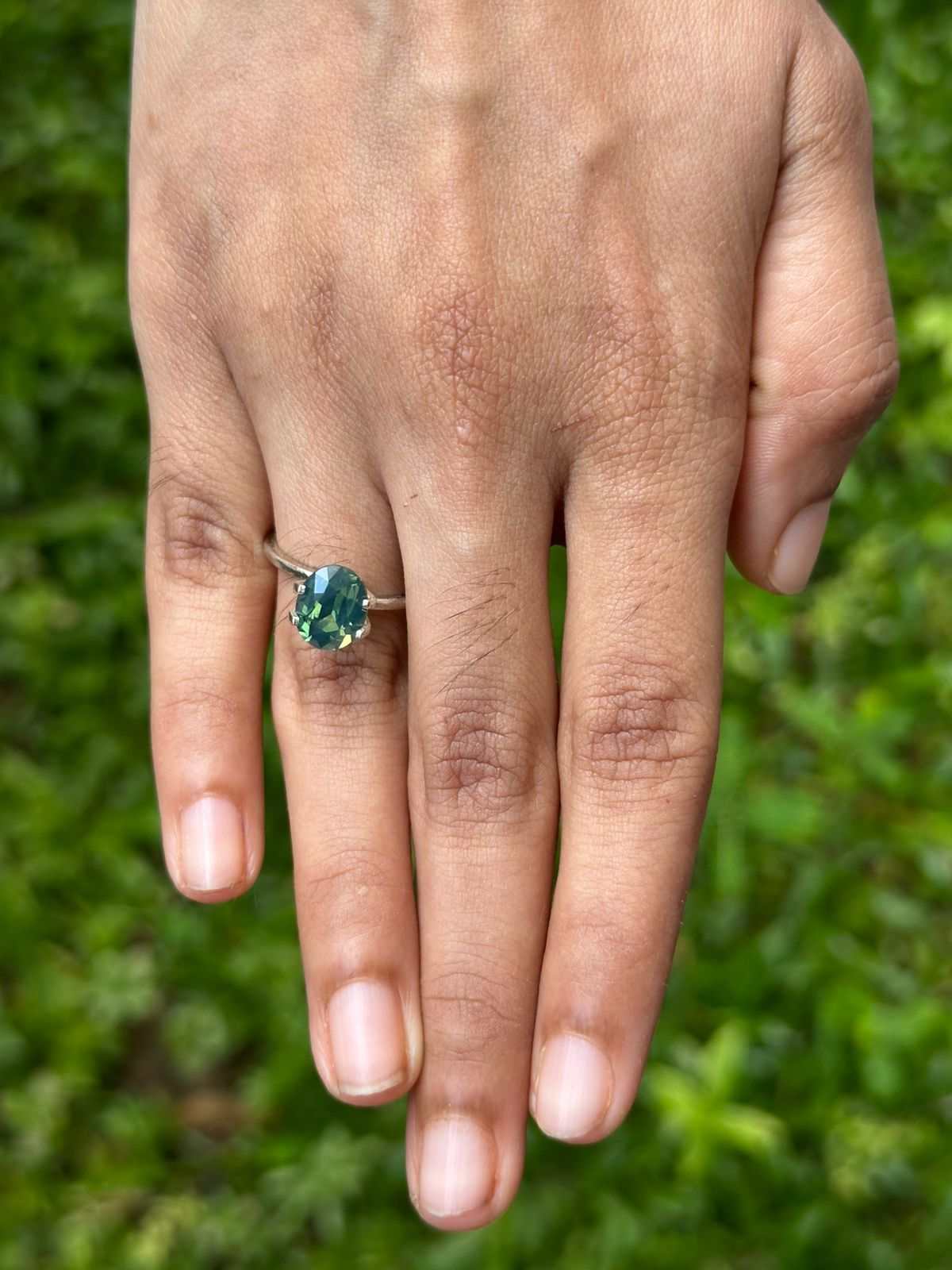 3.26 ct olive green sapphire gemstone with brilliant cut and rich olive hue