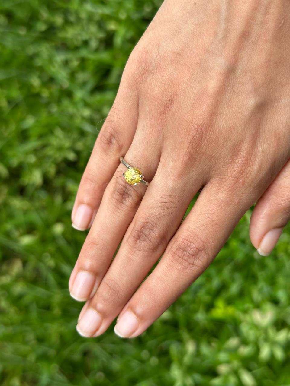 1.50ct Vivid Round Yellow Sapphire with stone in hand