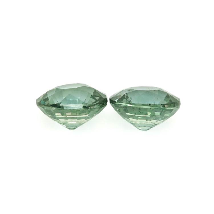 Matched pair of 1.50 ctw untreated teal sapphires with excellent clarity and expert cut for custom jewelry designs