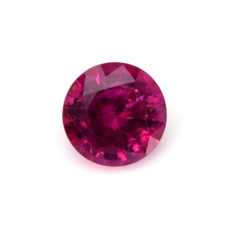 0.52 carat round cut ruby gemstone with deep red color and brilliant sparkle, ideal for custom jewelry designs