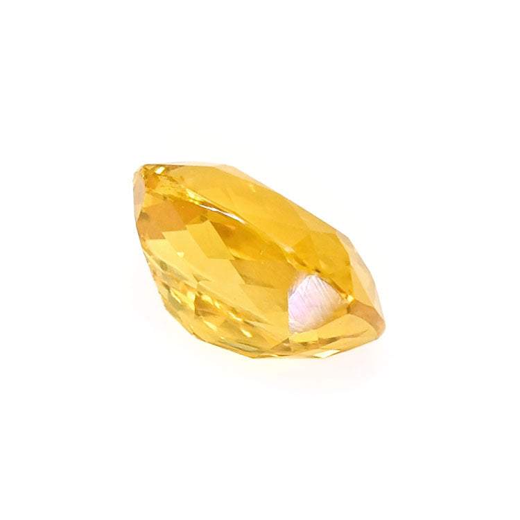 1.31 ct golden yellow sapphire cushion cut gemstone with brilliant faceting and rich orangish-yellow hue