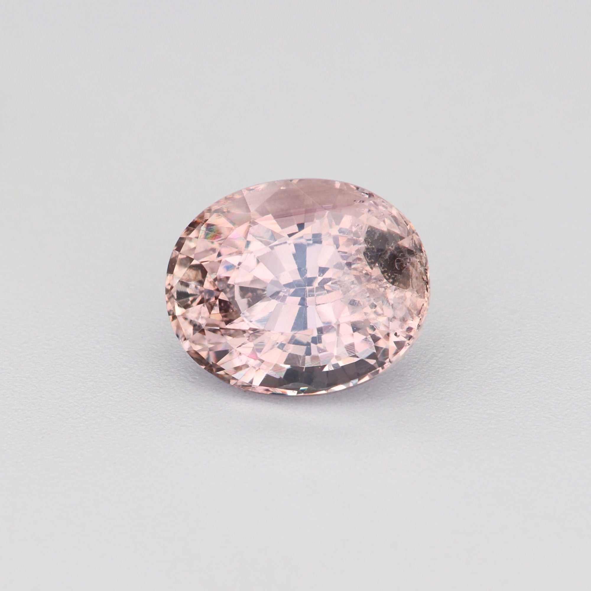 Natural peach sapphire loose stone under 1 carat, soft pink-orange hue