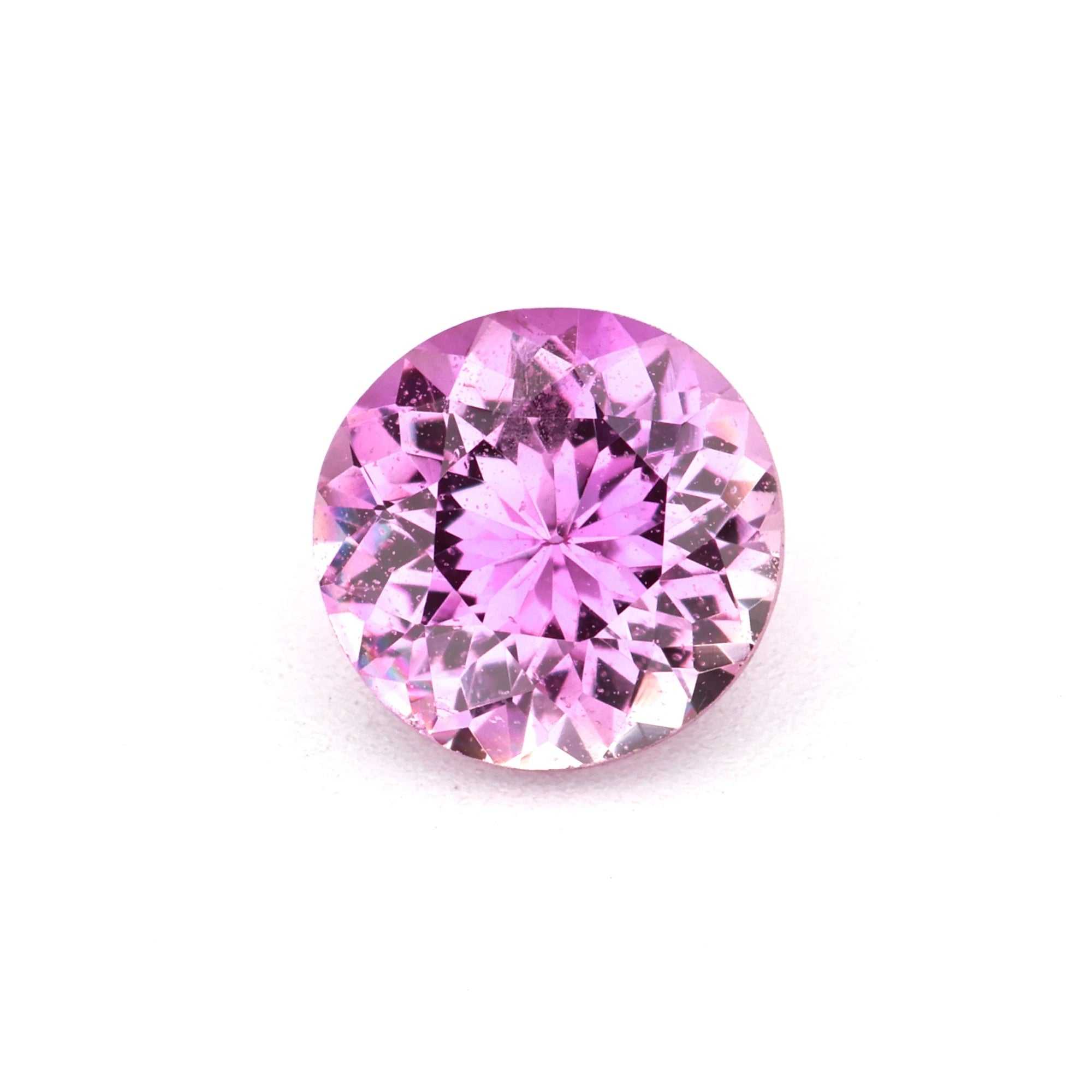 Close-up of a vibrant Pink Sapphire gemstones showcasing its brilliance and color variations