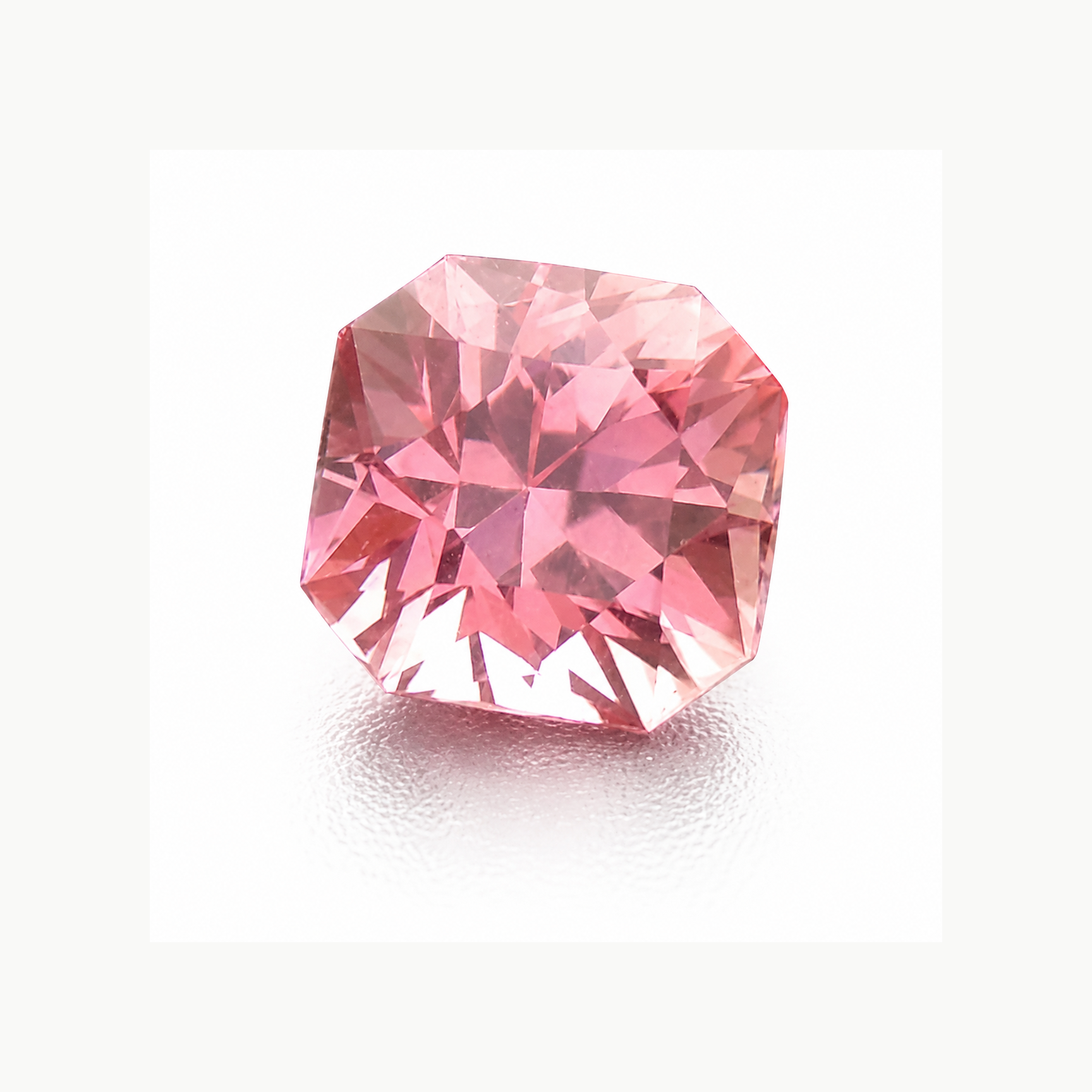 Close-up of a vibrant Pink Sapphire gemstones showcasing its brilliance and color variations