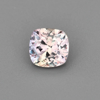 0.63 ct untreated violet sapphire with gray undertones, precision cut for brilliance and natural beauty
