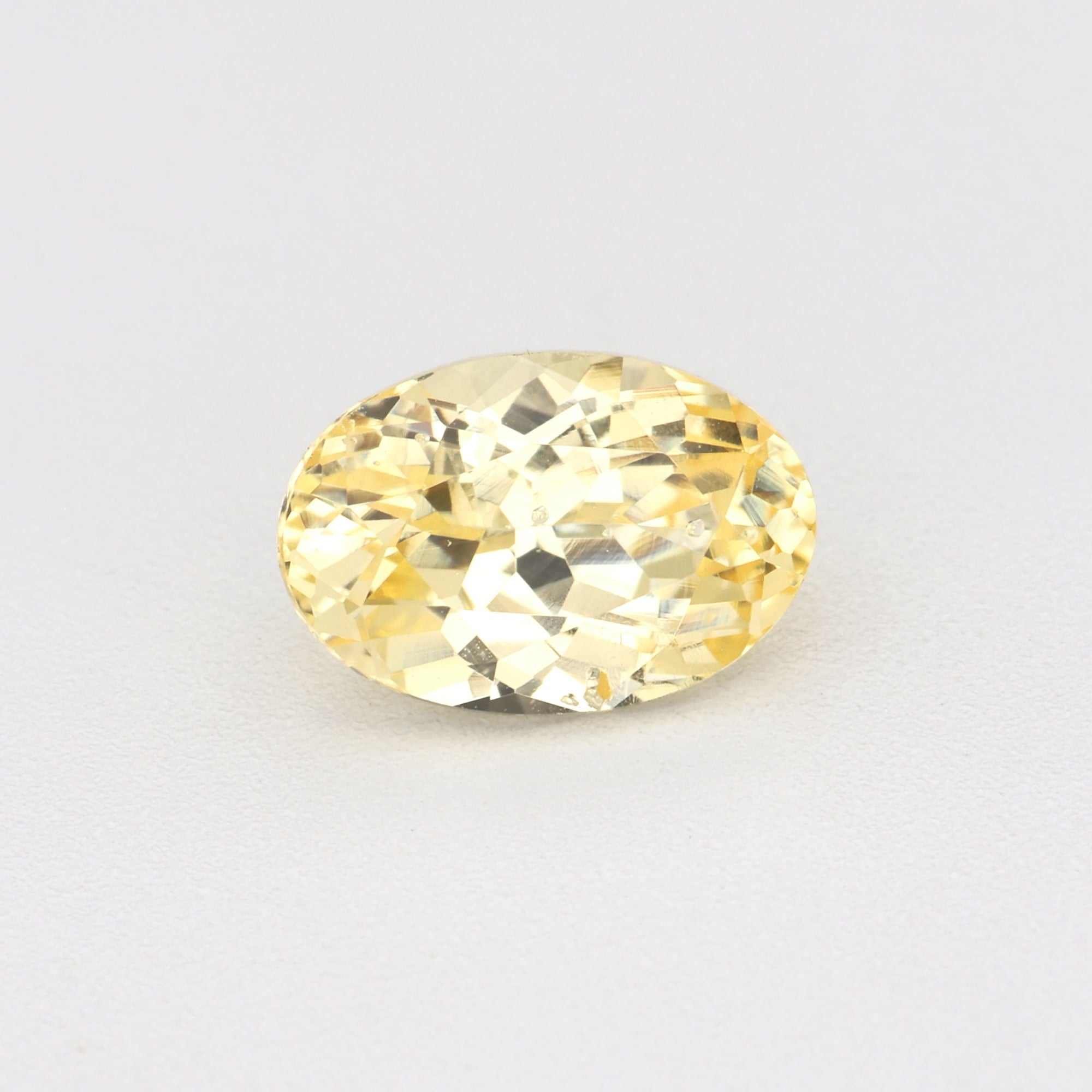 0.62ct unheated yellow sapphire gemstone with natural golden hue and excellent clarity